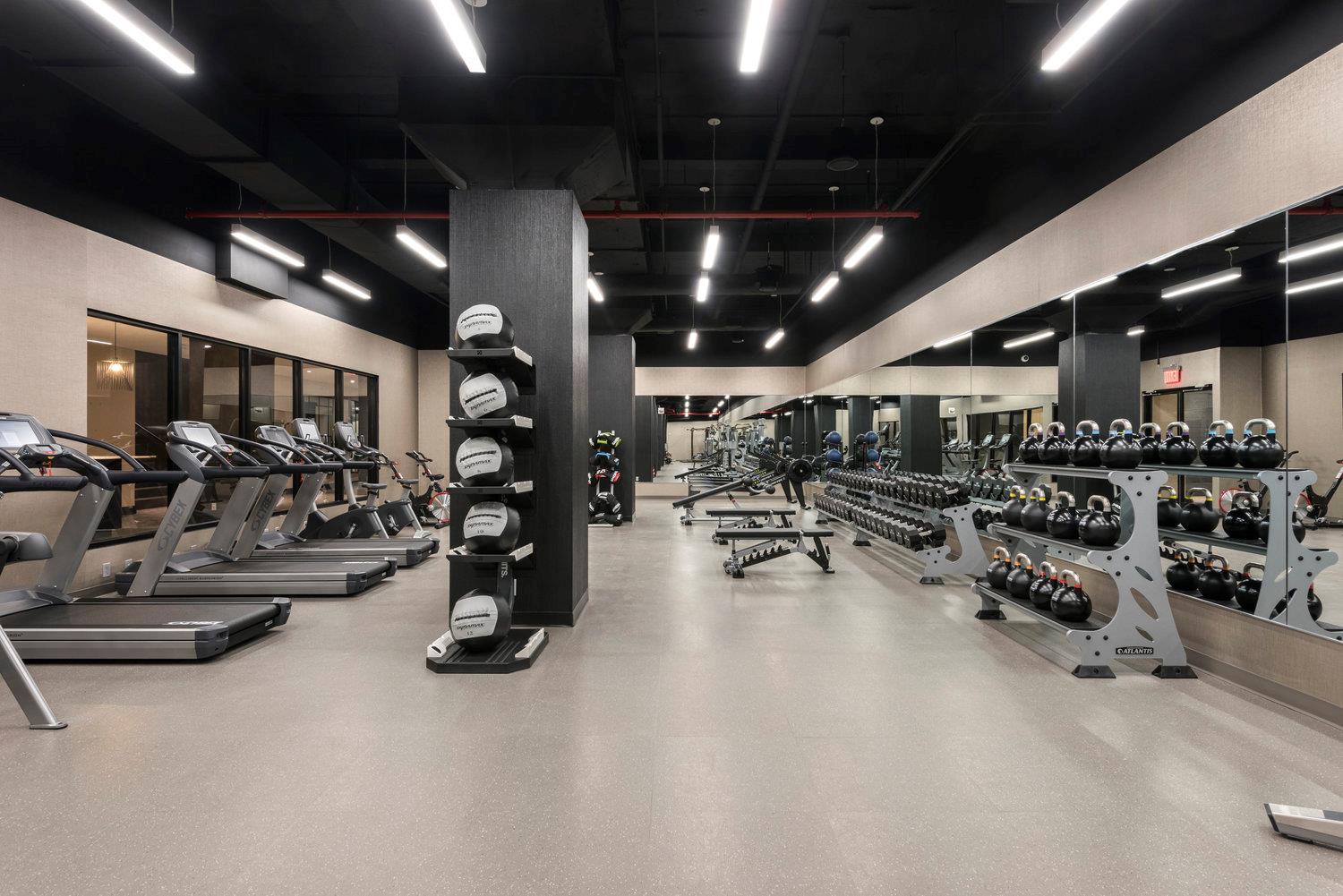 100 Barclay Street, Unit 13P Manhattan, NY 10007 - Photo 15 of 21 a view of a room with gym equipment