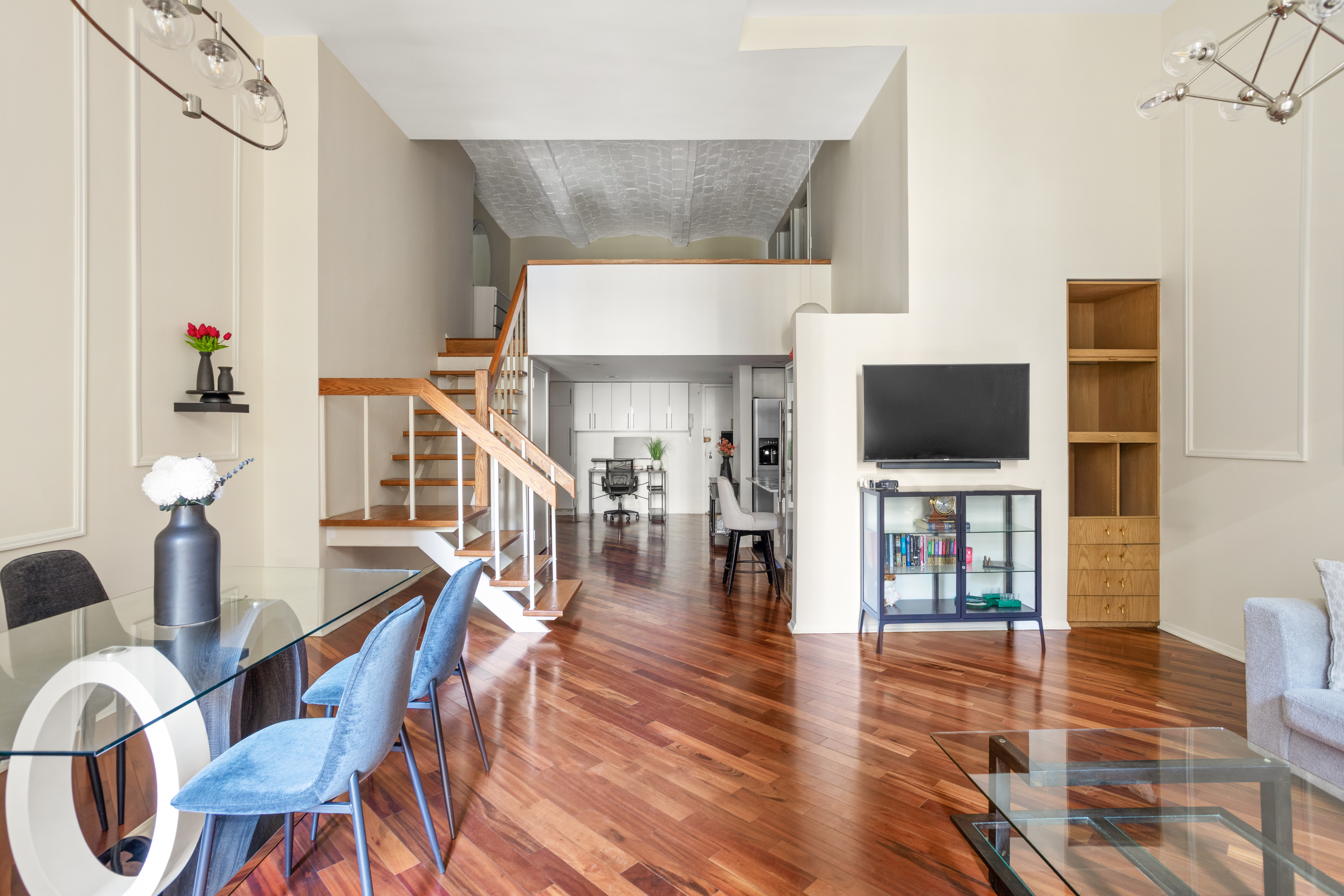 372 5th Avenue, Unit 3M Manhattan, NY 10018 - Photo 6 of 14 a view of a livingroom with wooden floor and furniture