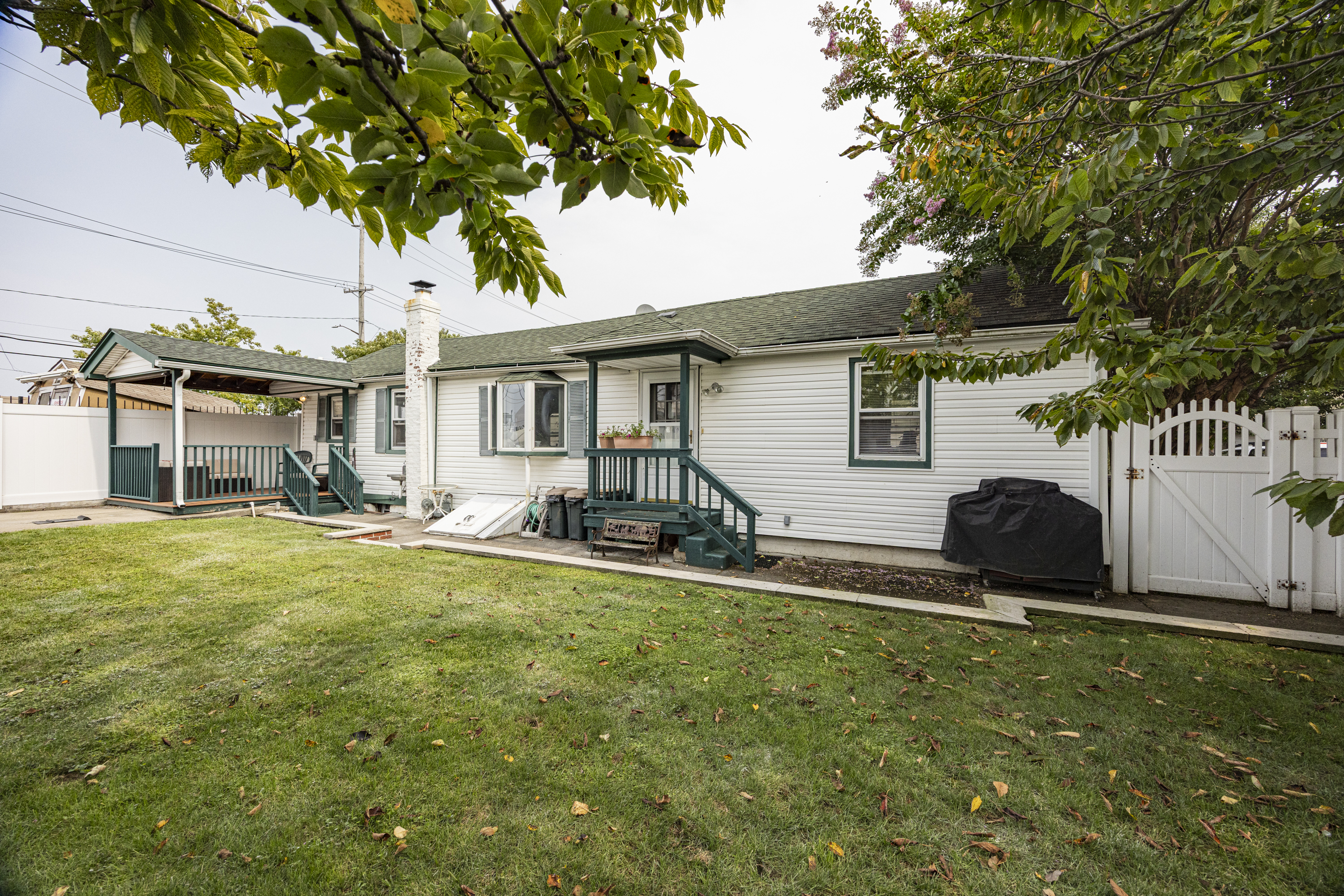 355 D Dormans Court Queens, NY 11693 - Photo 13 of 21 a view of a house with backyard and sitting area