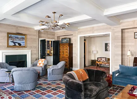 a living room with furniture fireplace and window