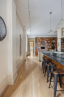 a very nice looking room with a large window and wooden floor