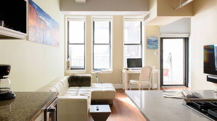 a living room with furniture and a flat screen tv