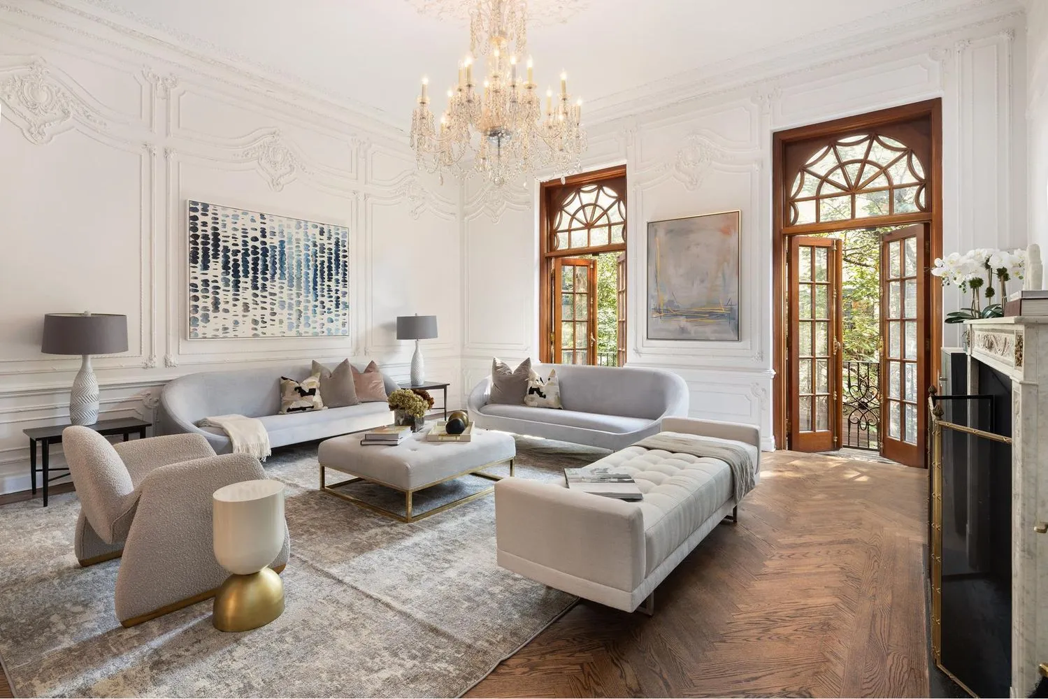 a living room with furniture windows and a chandelier