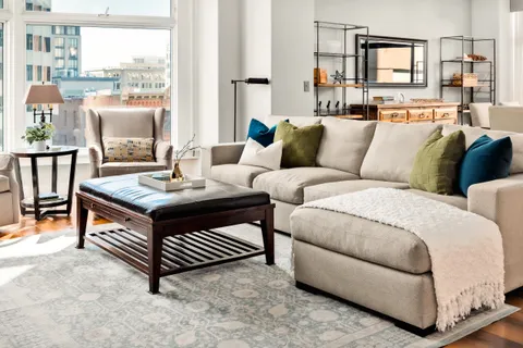 a living room with furniture and a window