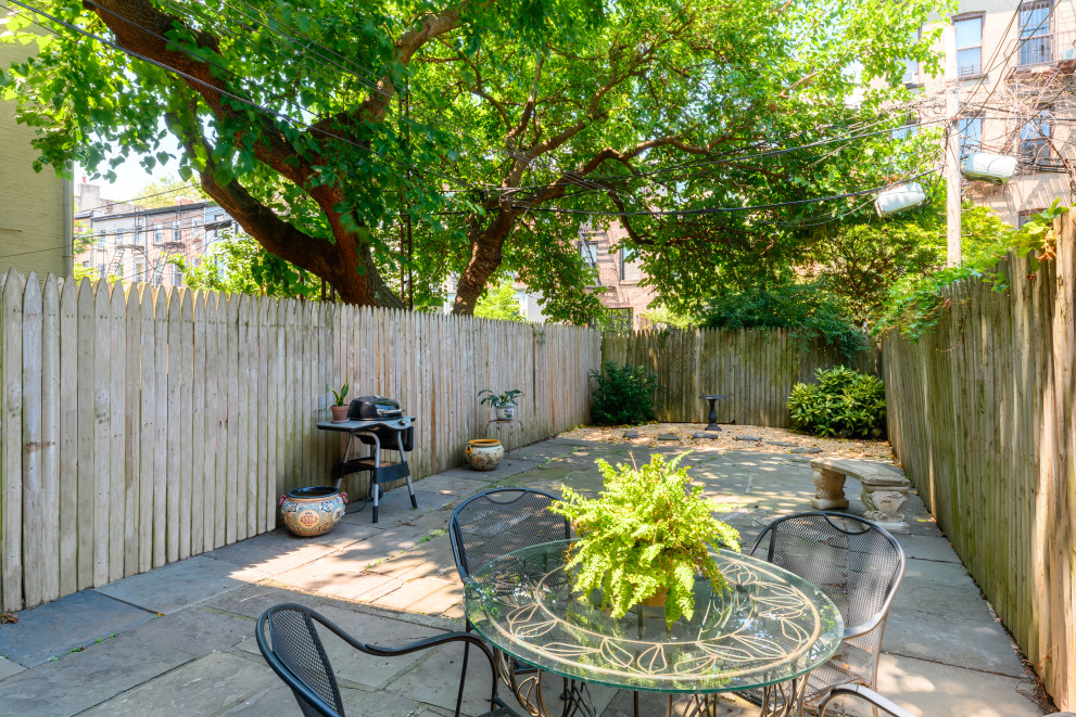 20 Strong Place Brooklyn, NY 11231 - Photo 19 of 21 a backyard of a house with table and chairs