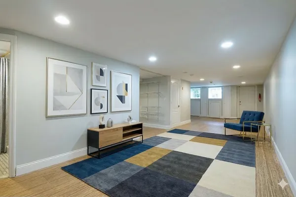 a living room with furniture and a rug