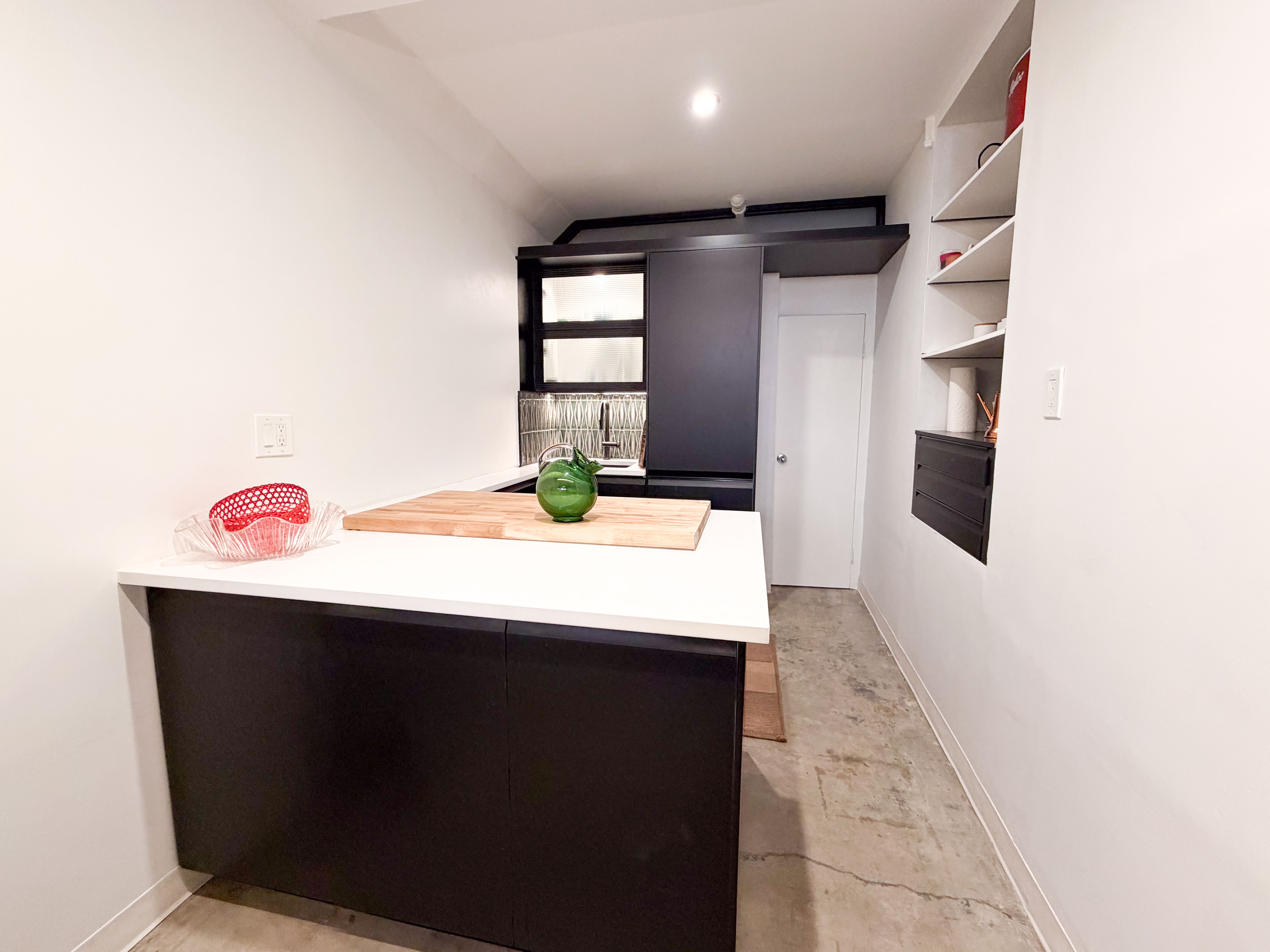 206 East 7th Street, Unit G Manhattan, NY 10009 - Photo 7 of 22 a kitchen with a sink and cabinets