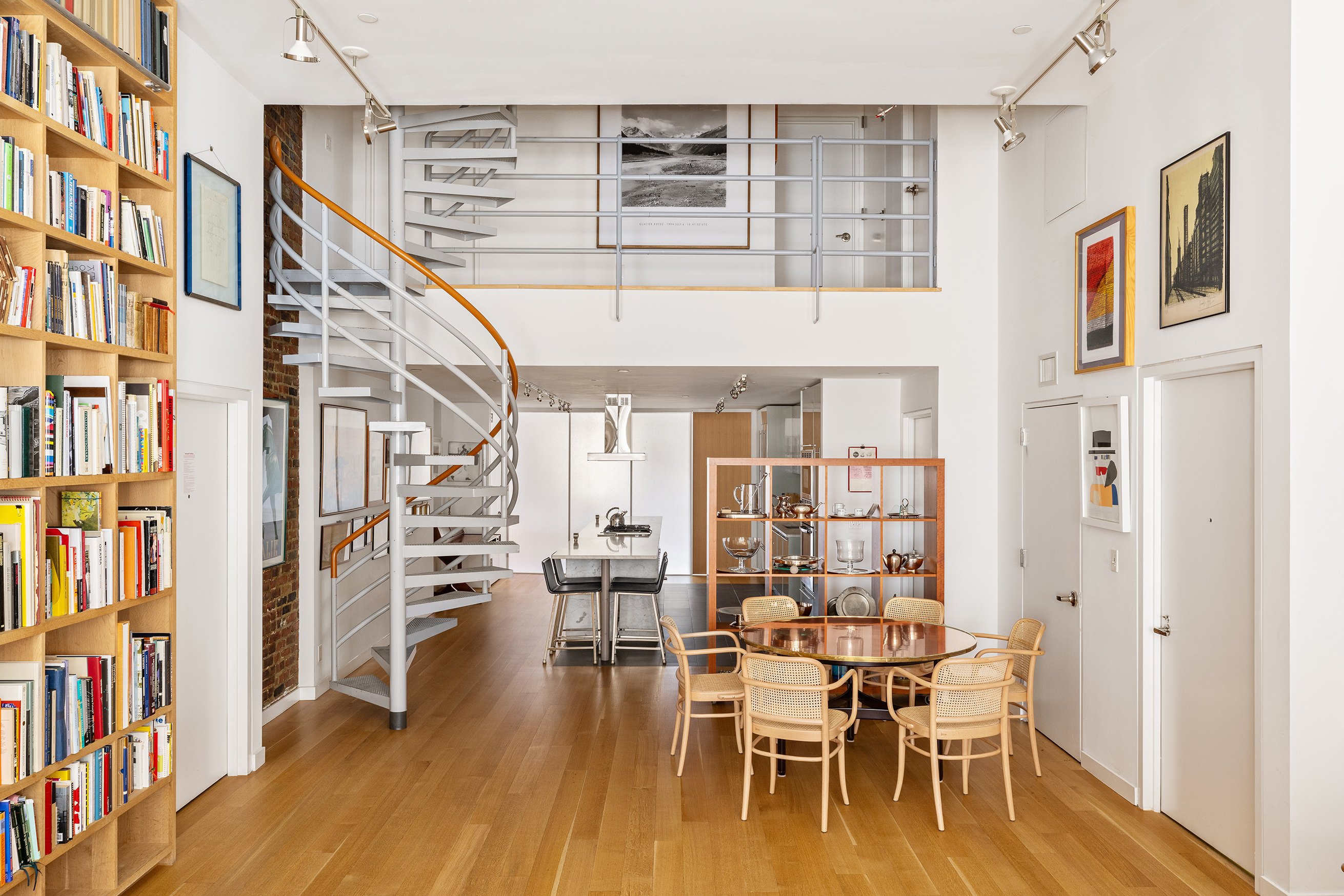 71 Ludlow Street, Unit 4B Manhattan, NY 10002 - Photo 5 of 15 a dining room with wooden floor table and chairs