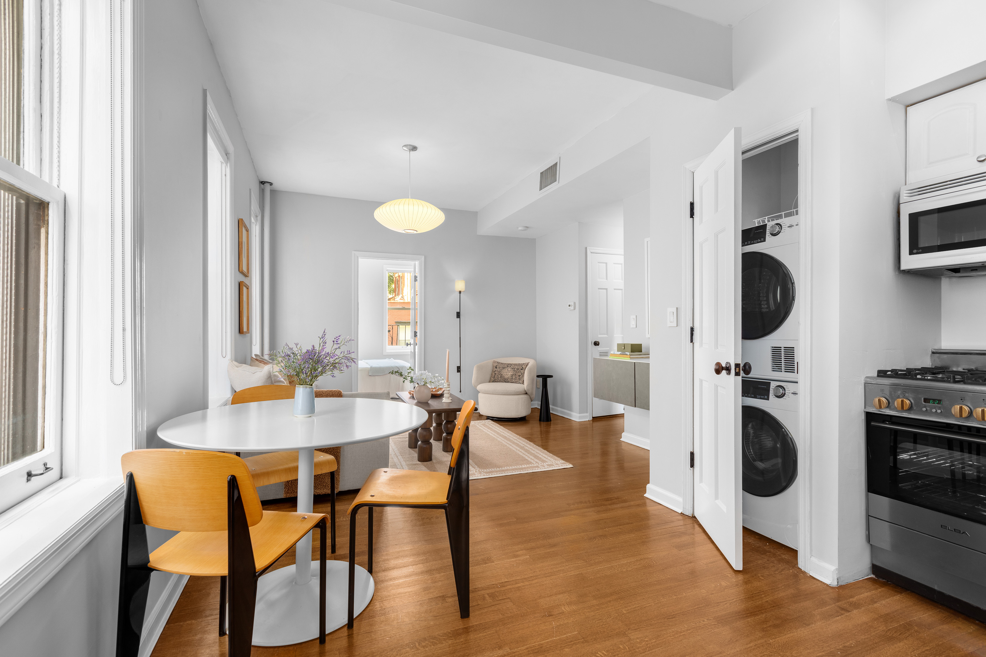 92 Perry Street, Unit 6 Manhattan, NY 10014 - Photo 4 of 10 a view of a dining room with furniture and a kitchen