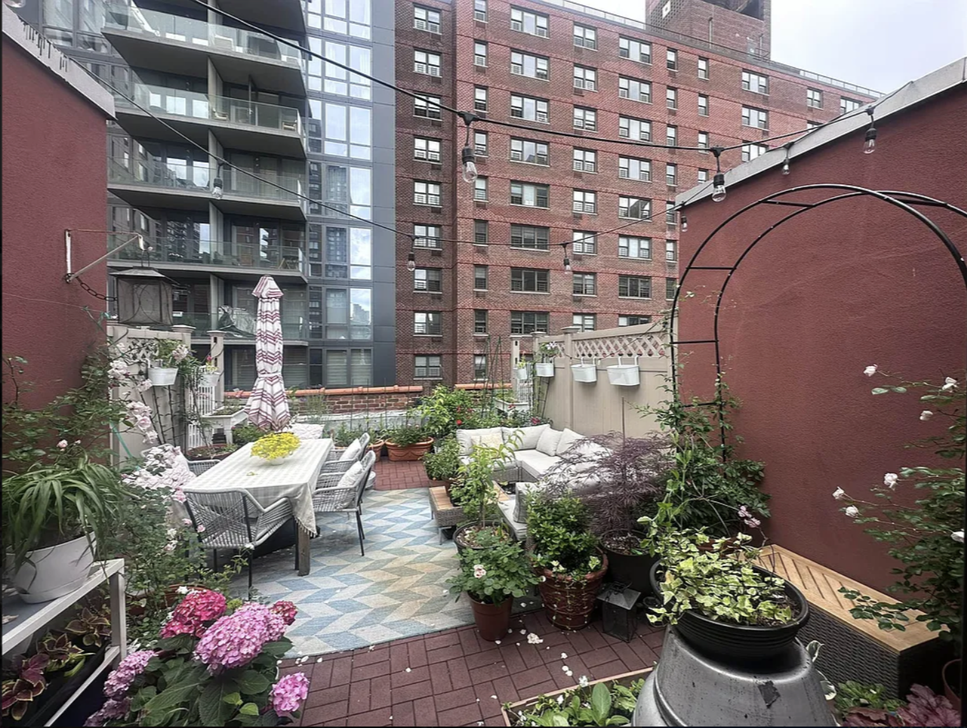 a backyard of a house with lots of green space and fountain