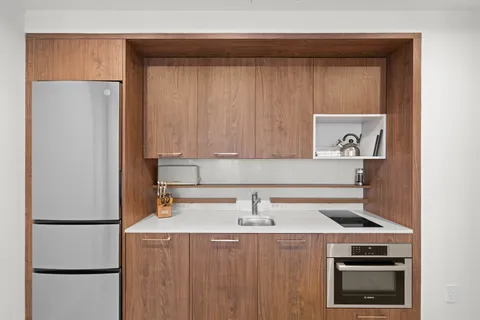 a kitchen with a stove and a refrigerator