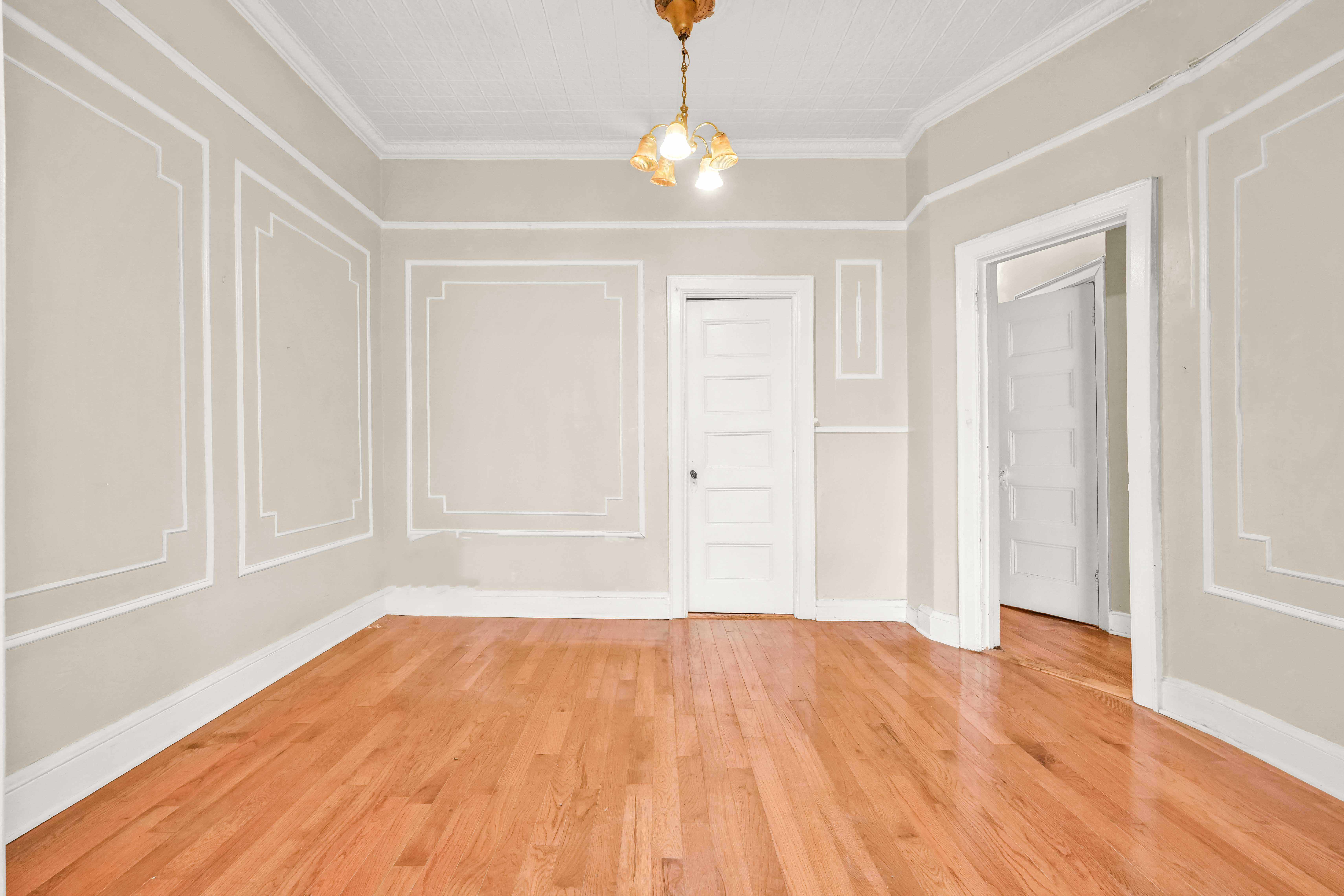 278 Lefferts Avenue Brooklyn, NY 11225 - Photo 27 of 56 wooden floor in an empty room with a window