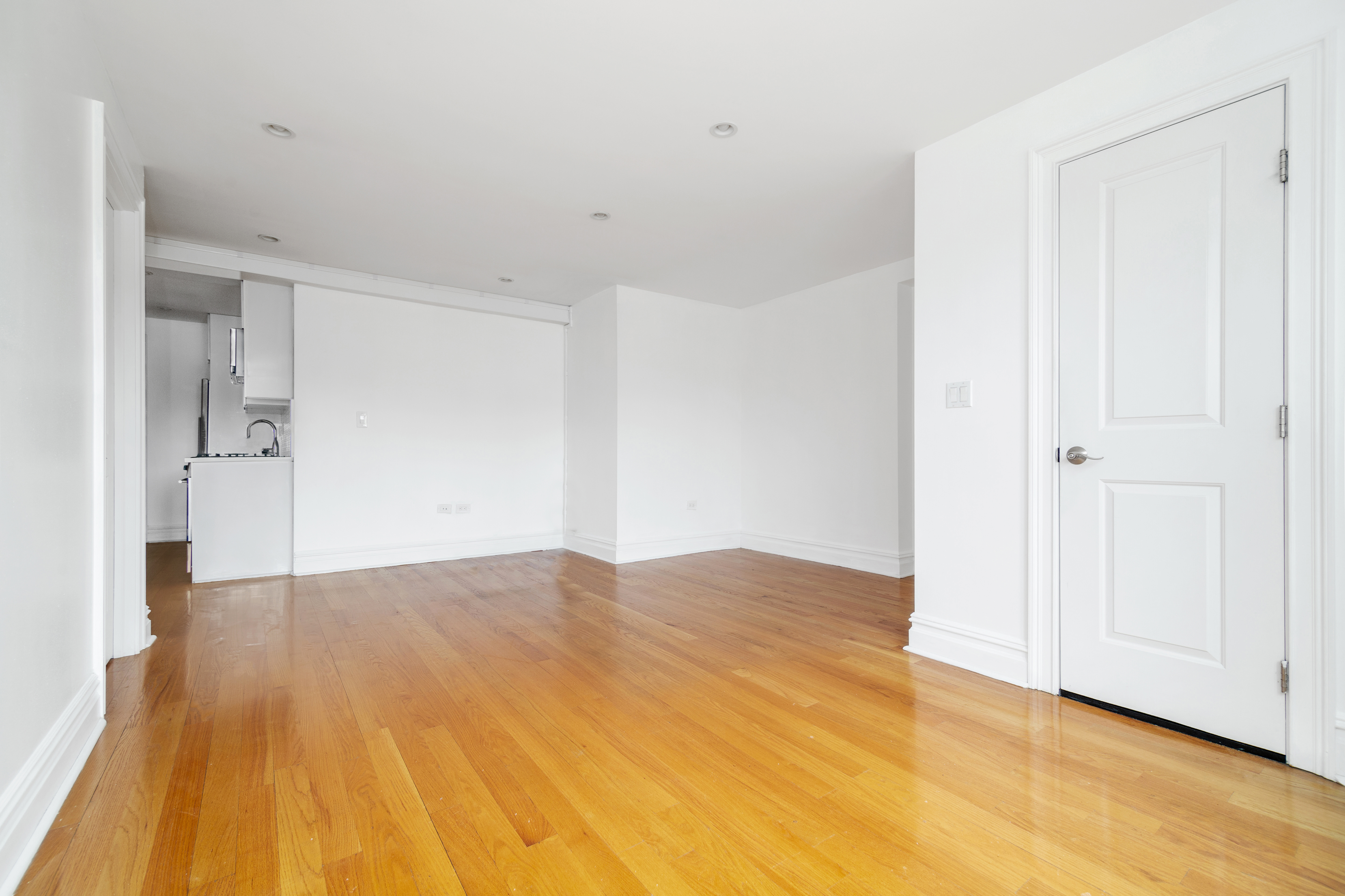 69 Bennett Avenue, Unit 608 Manhattan, NY 10033 - Photo 4 of 6 a view of empty room with wooden floor