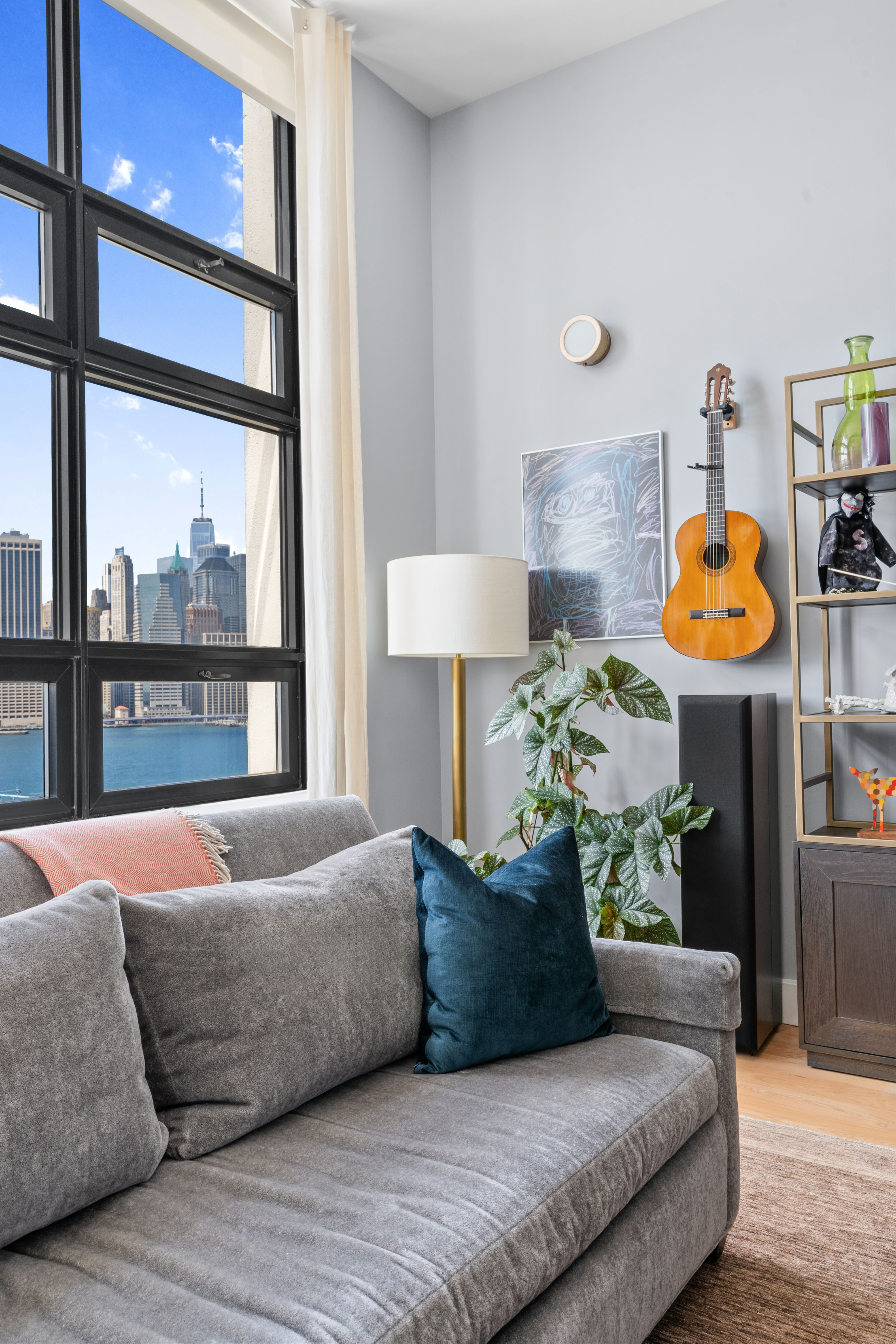 360 Furman Street, Unit 734 Brooklyn, NY 11201 - Photo 4 of 31 a living room with furniture and a window