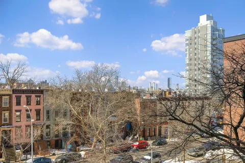 a view of a city with tall buildings