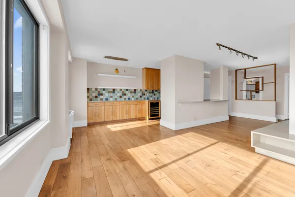 a view of a living room with a wooden floor