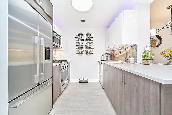 2351 Adam Clayton Powell Jr Boulevard, Unit 306 Manhattan, NY 10030 - Photo 2 of 13 a kitchen with a sink and refrigerator