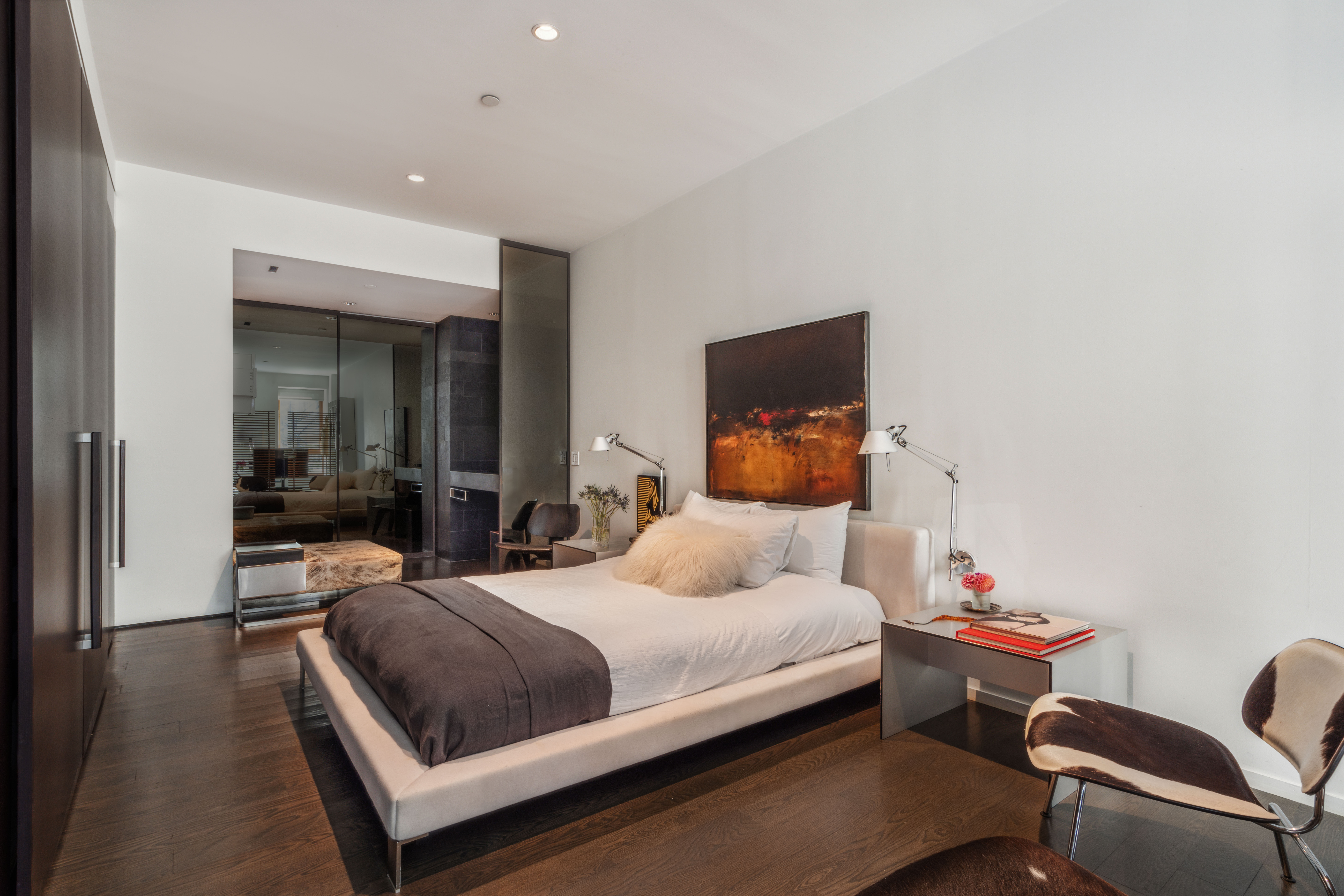 497 Greenwich Street, Unit 2C Manhattan, NY 10013 - Photo 11 of 21 a bedroom with a bed and wooden floor