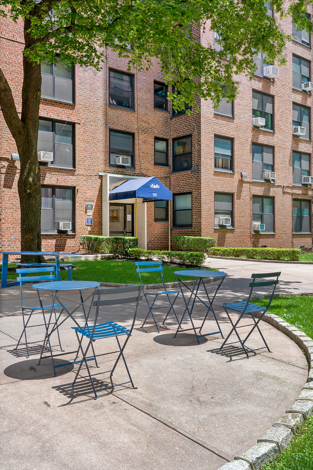 193 Clinton Avenue, Unit 9D Brooklyn, NY 11205 - Photo 10 of 11 a view of a chairs and table in backyard