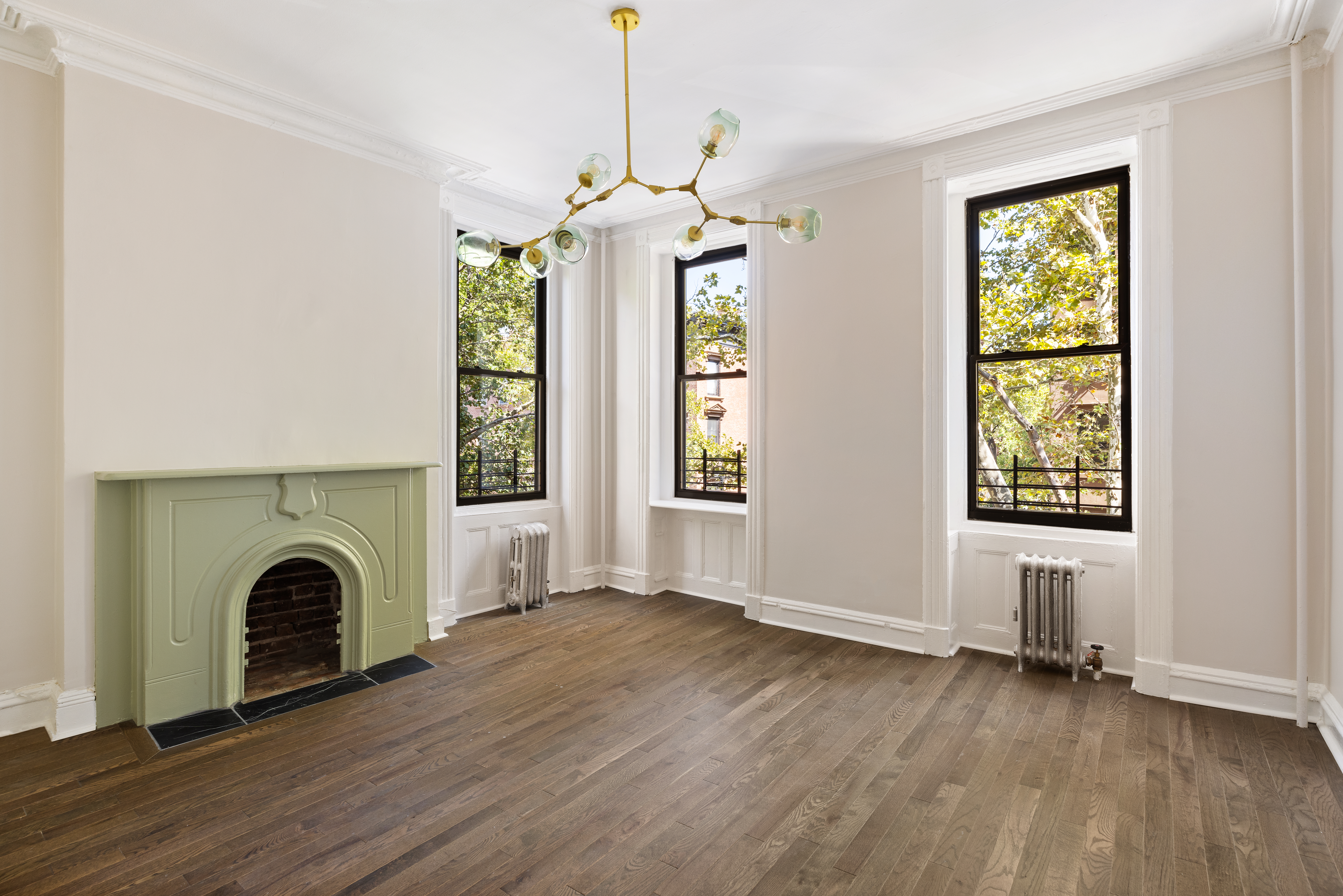 a view of livingroom with furniture window wooden floor and windows