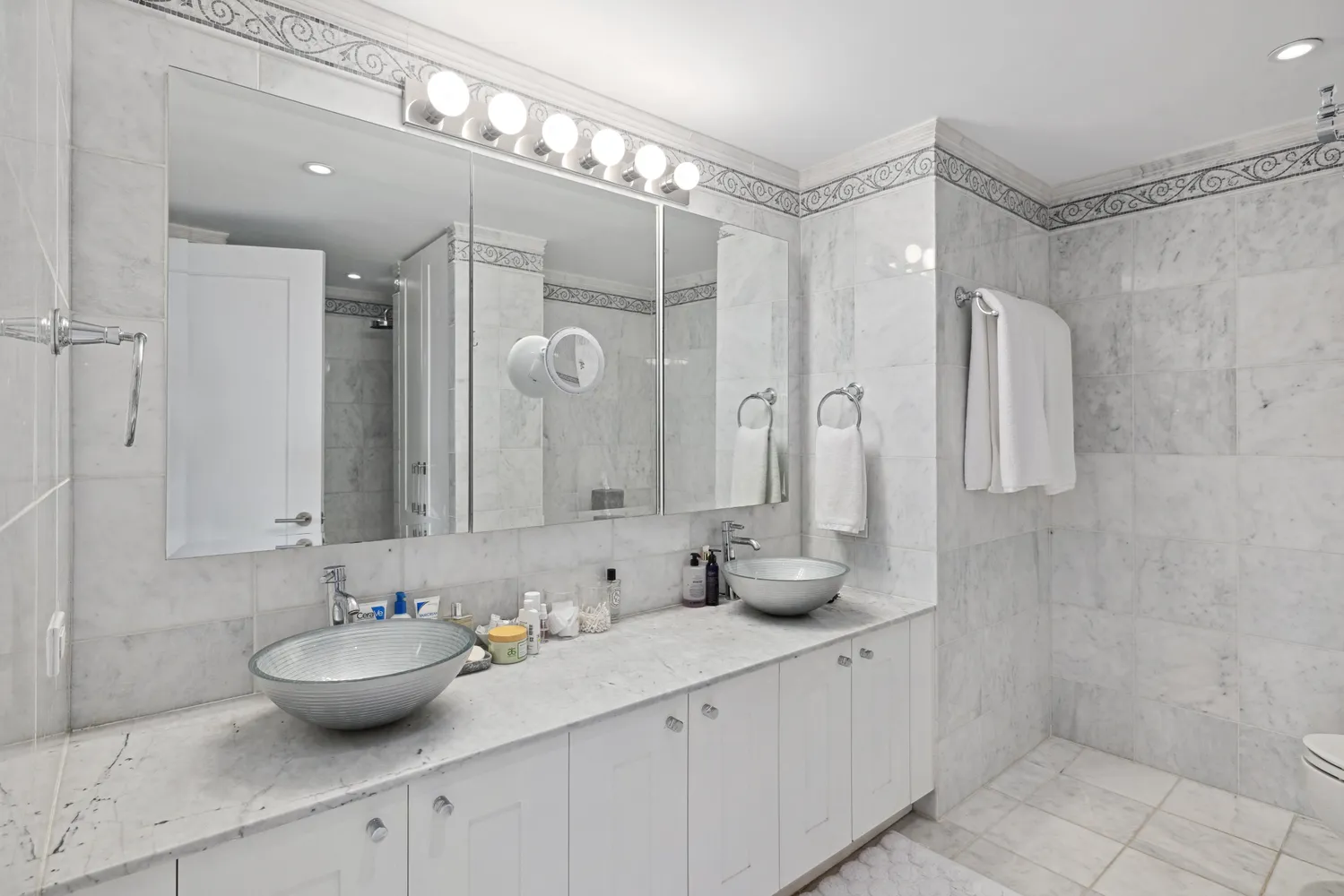 a bathroom with a double vanity sink mirror and double