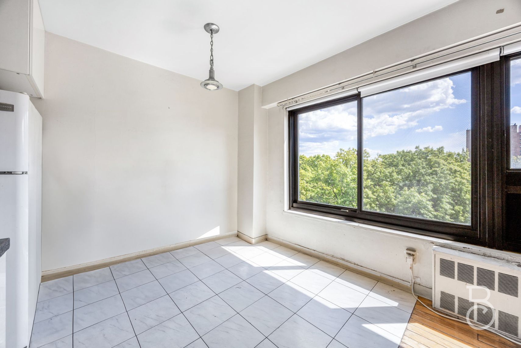 33-47 14th Street, Unit 6D Queens, NY 11106 - Photo 3 of 12 a view of an empty room with a window
