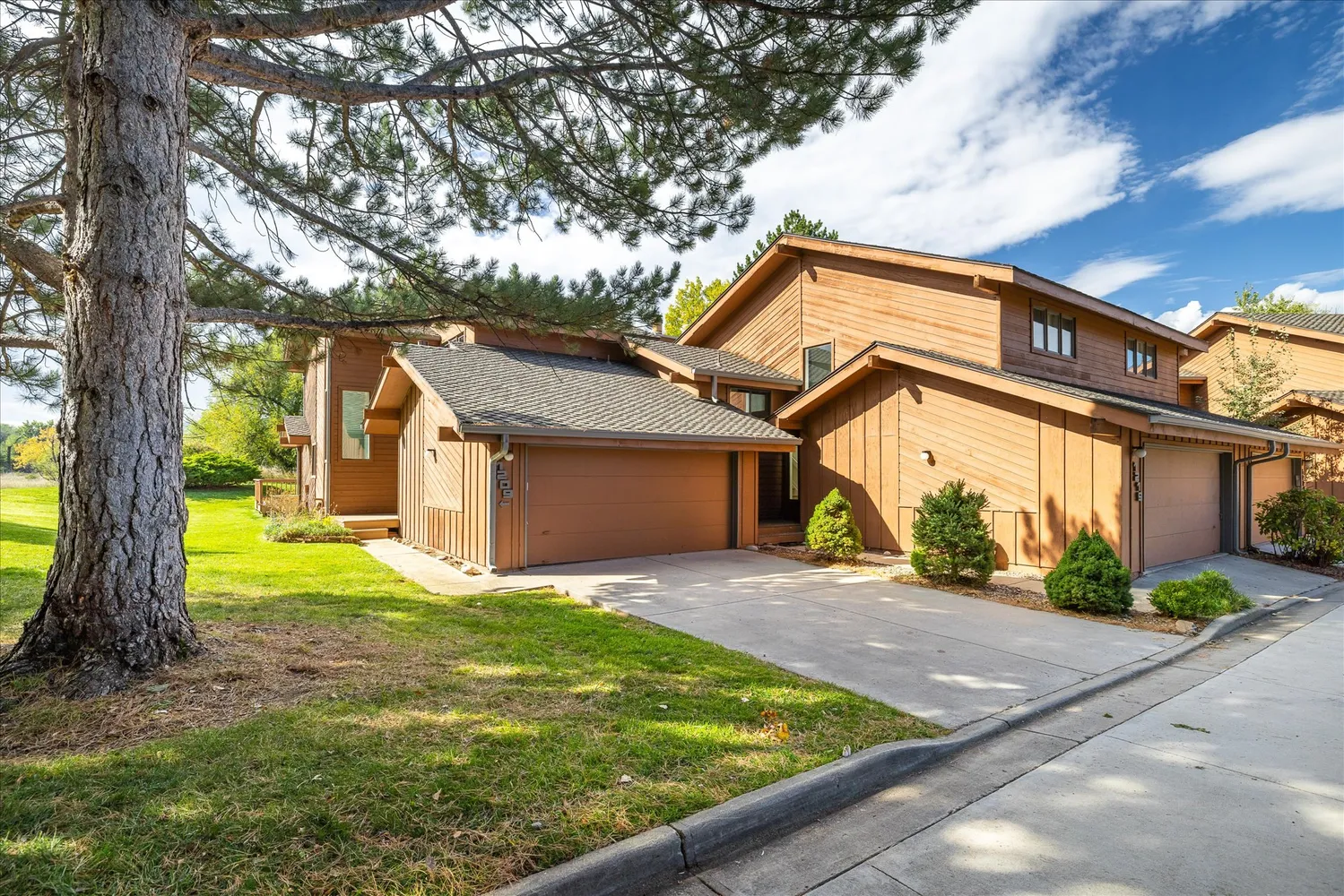 a backyard of a house with yard and outdoor seating