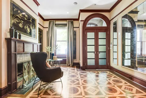 a view of a balcony with chair and glass door