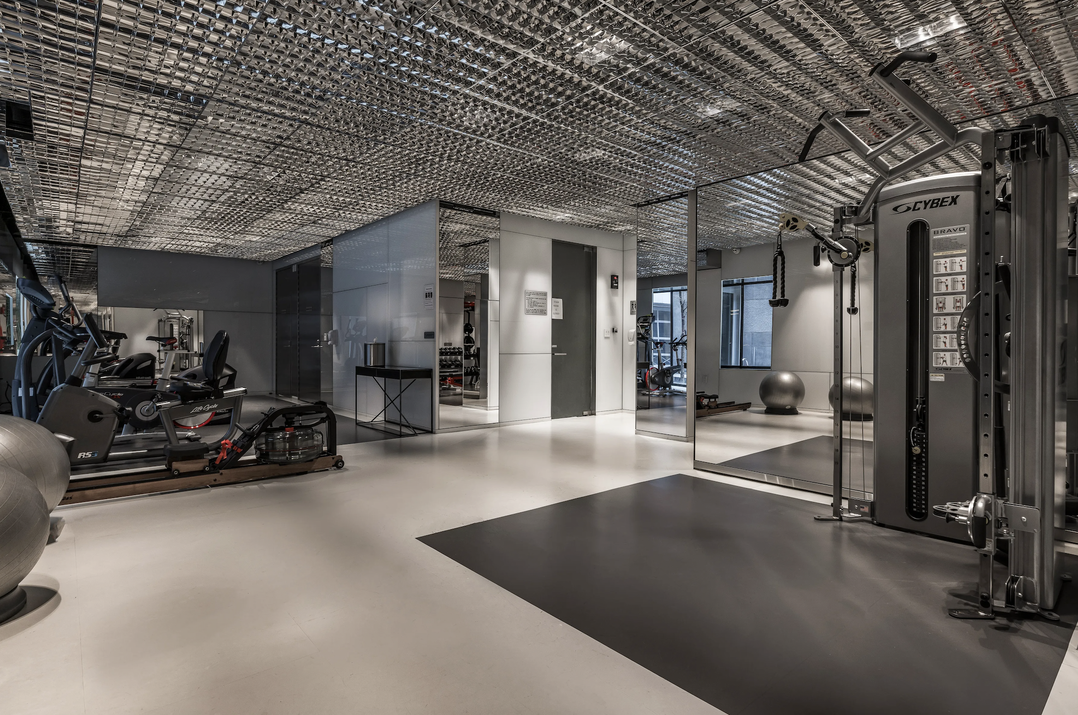 100 11th Avenue, Unit 7D Manhattan, NY 10011 - Photo 11 of 15 a view of a room with gym equipment