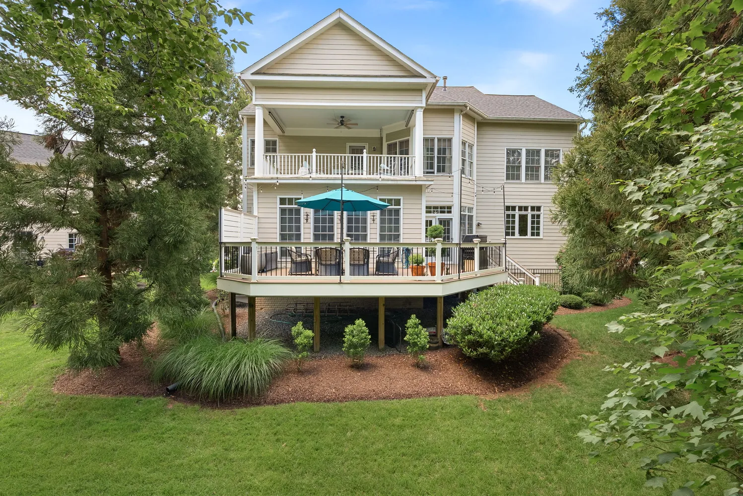 a aerial view of a house with a yard and potted plants