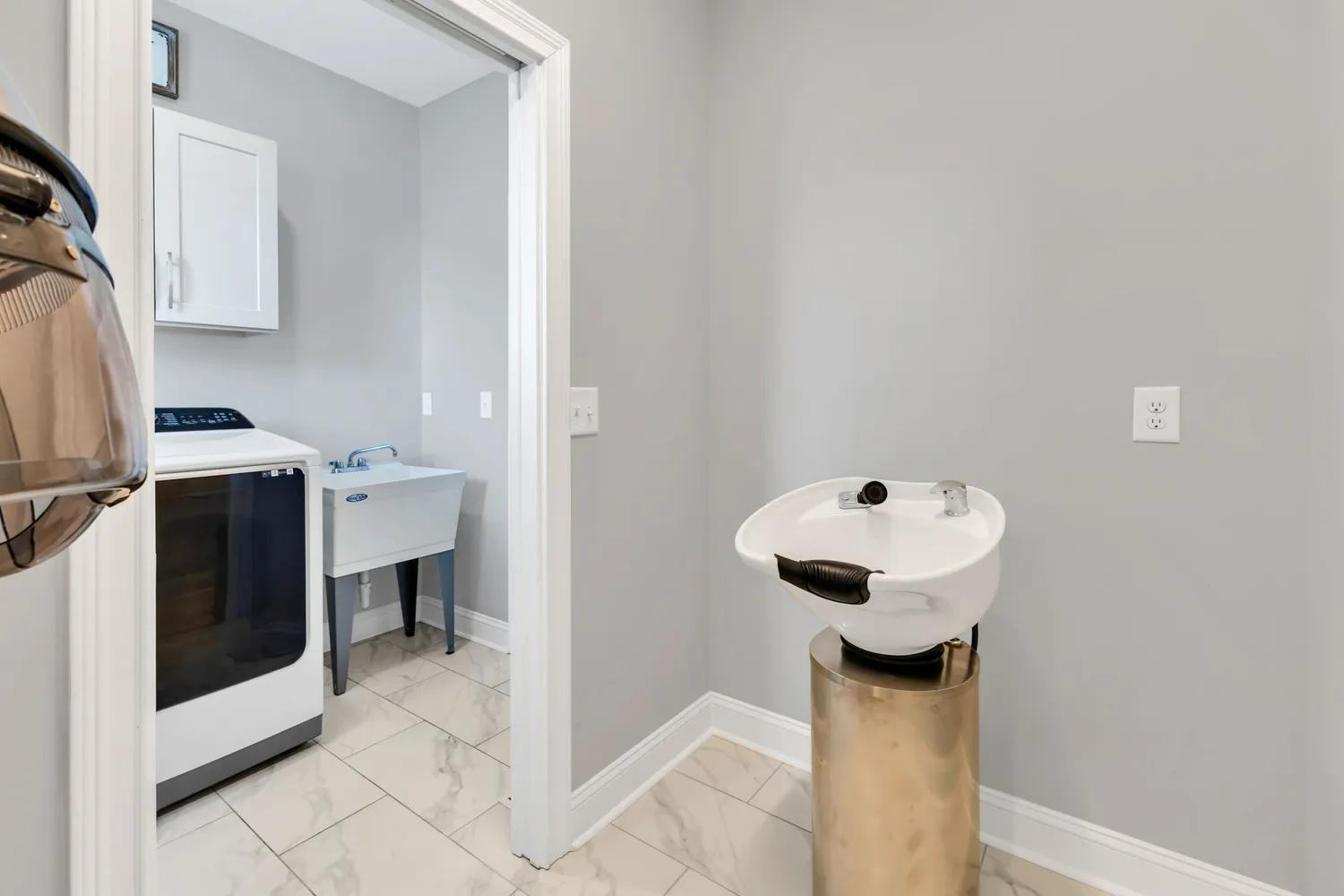 a bedroom with a bed and a flat tv screen on the dresser