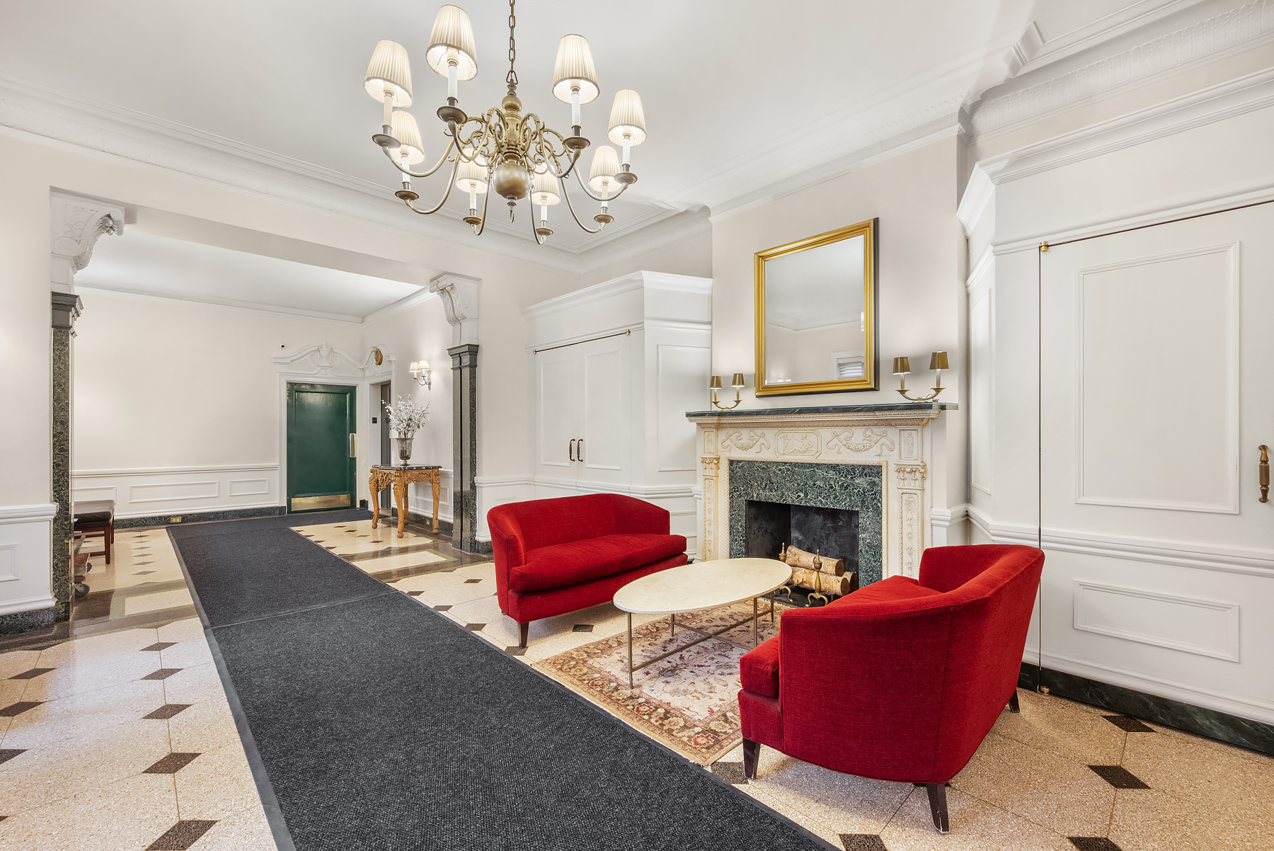 440 West End Avenue, Unit 2E Manhattan, NY 10024 - Photo 11 of 12 a living room with furniture fireplace and chandelier