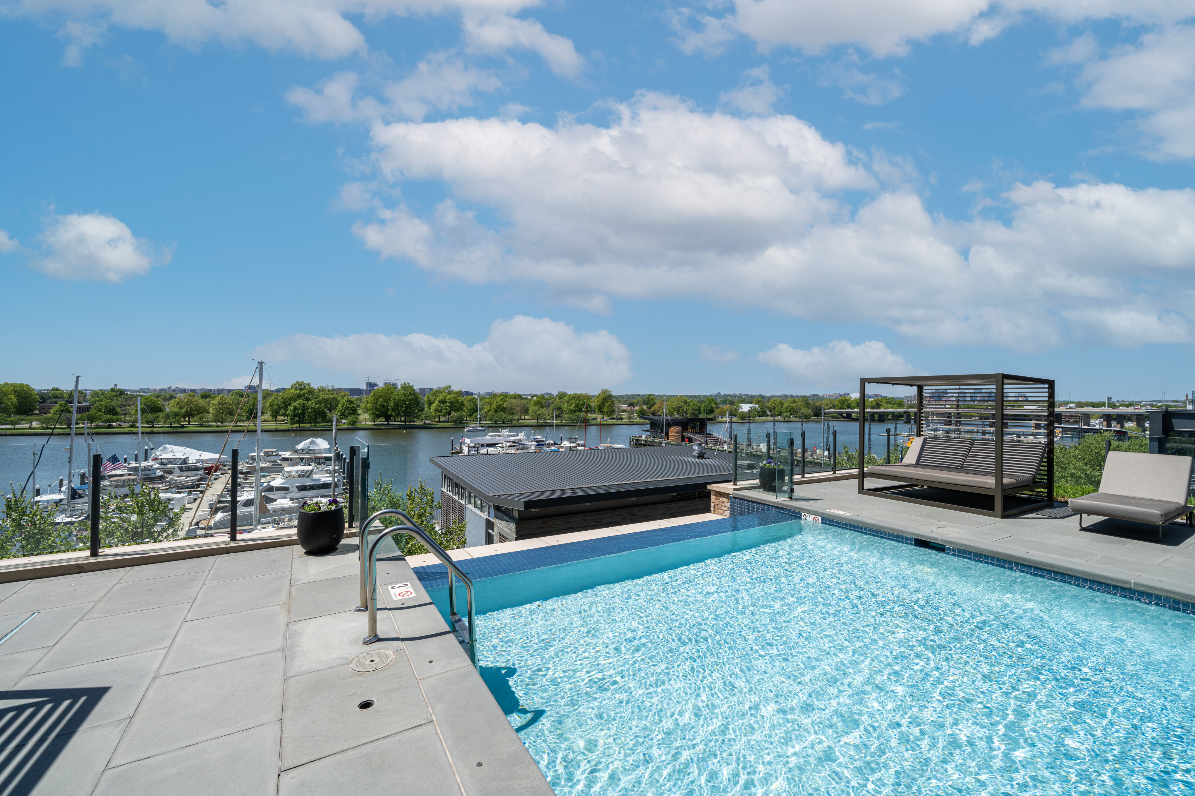 45 Sutton Square Southwest, Unit PH10 Washington, DC 20024 - Photo 3 of 44 a view of a terrace with lawn chairs