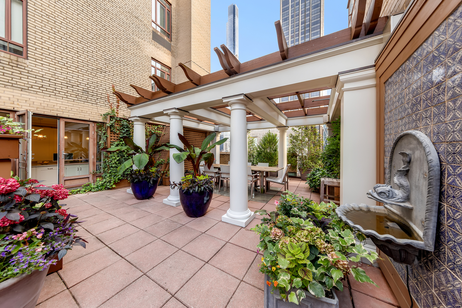 25 Central Park West, Unit 21J Manhattan, NY 10023 - Photo 2 of 37 a view of a chairs and table in a patio