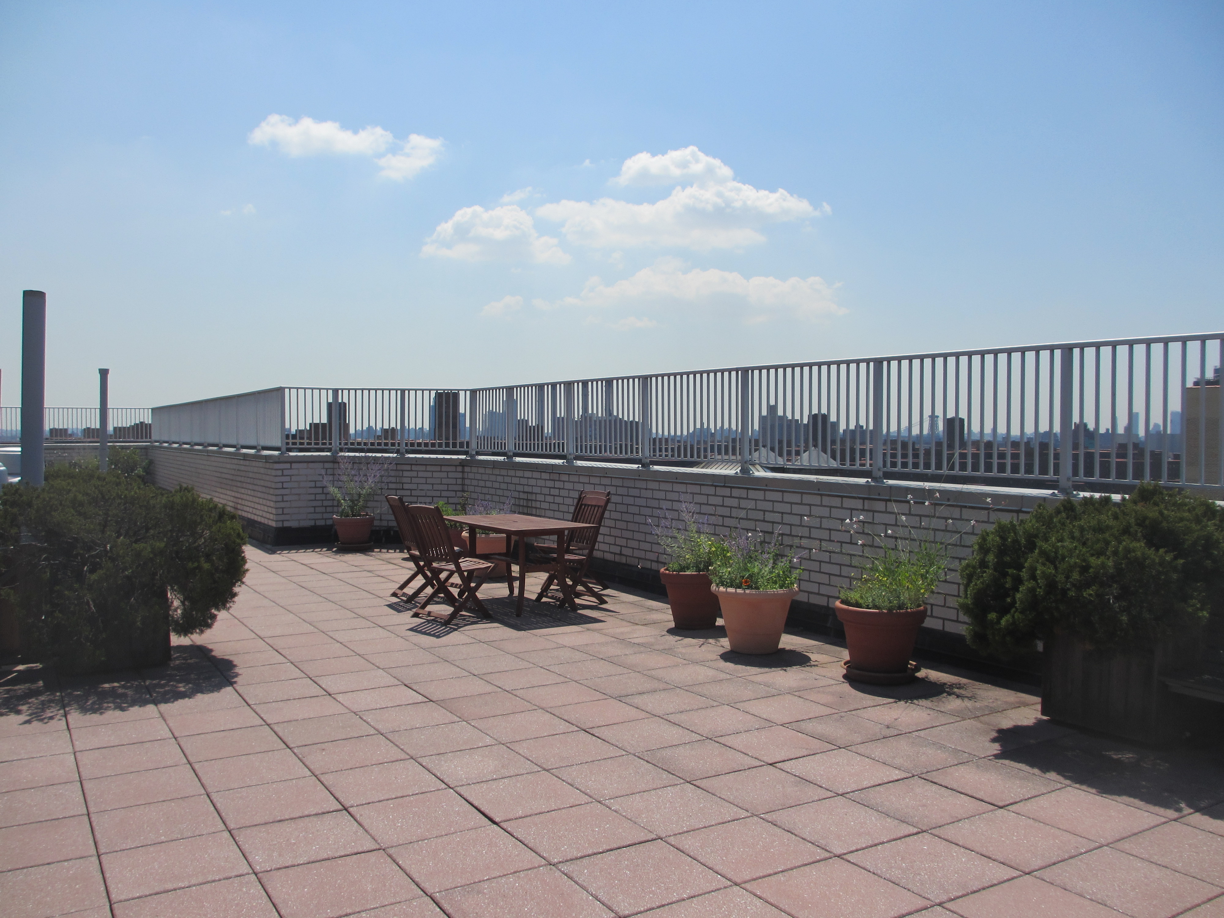 301 East 22nd Street, Unit 5G Manhattan, NY 10010 - Photo 7 of 10 a terrace with outdoor seating and city view