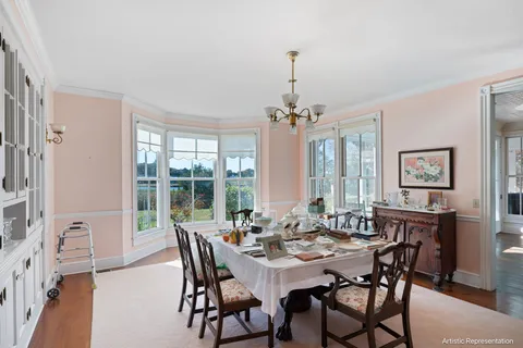 a view of a dining room with furniture window and outside view