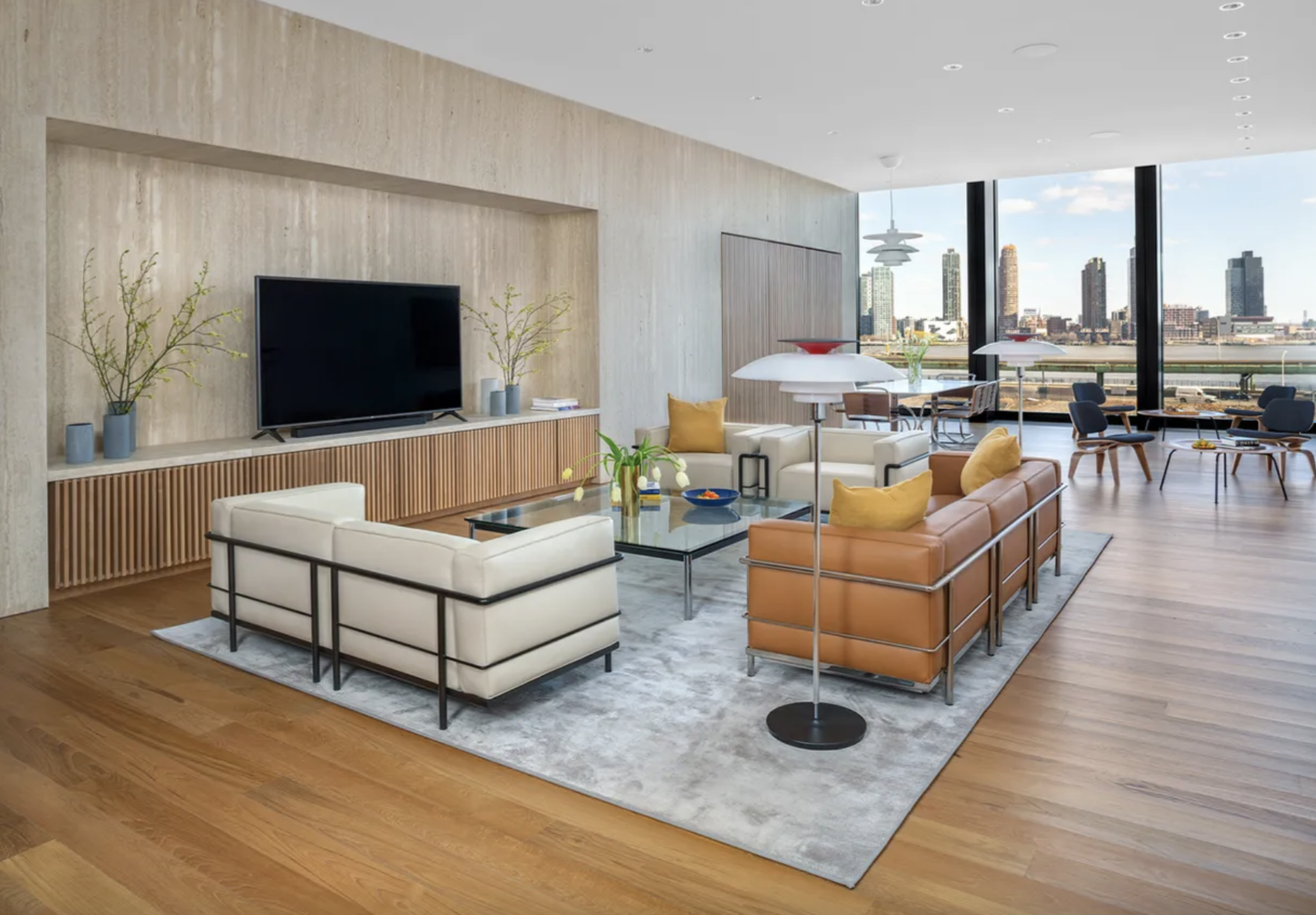 695 1st Avenue, Unit 31C Manhattan, NY 10016 - Photo 22 of 27 a living room with furniture and a flat screen tv