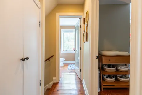 a view of a bathroom from a hallway