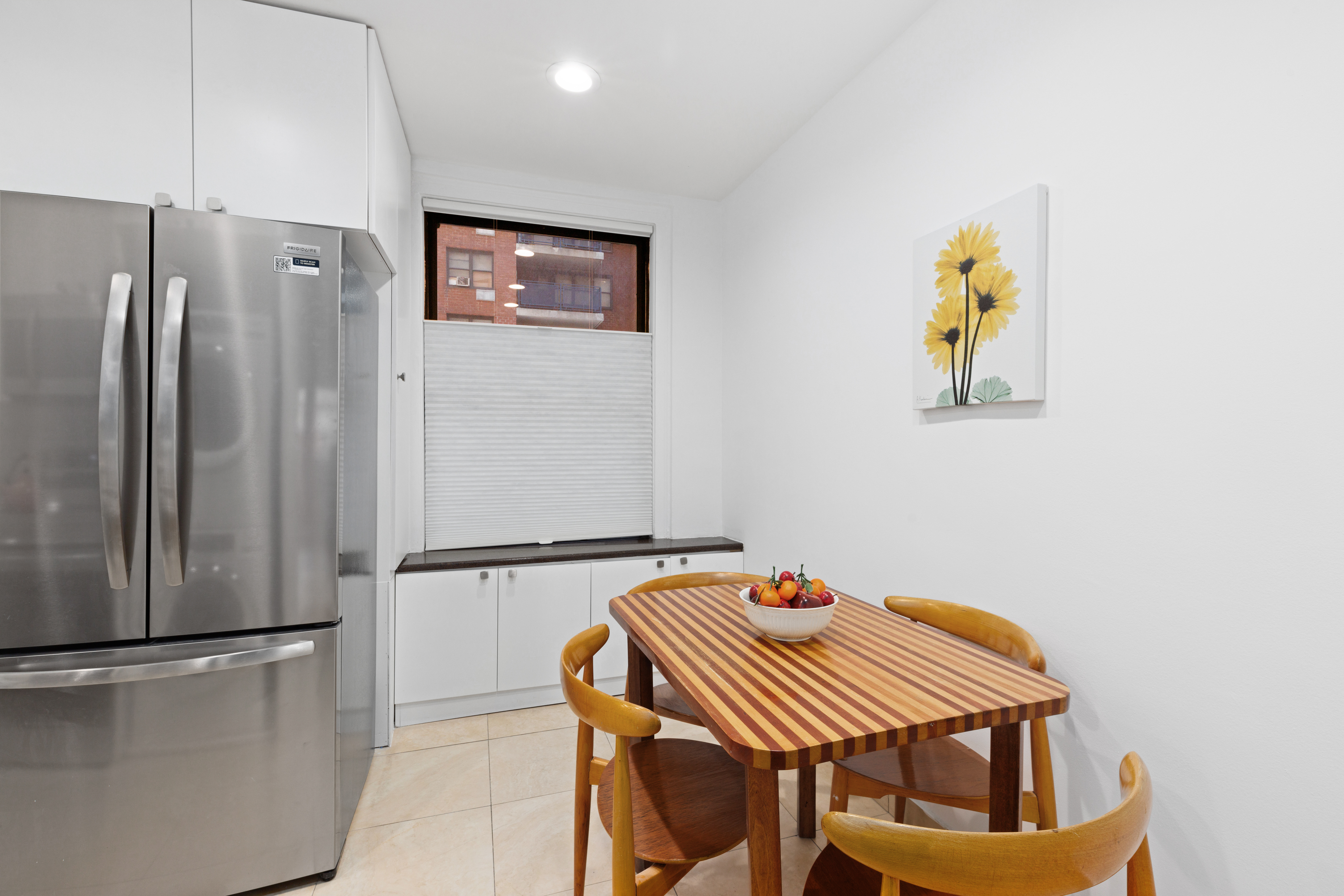 175 West 93rd Street, Unit 3D Manhattan, NY 10025 - Photo 5 of 10 a kitchen with a refrigerator and a stove