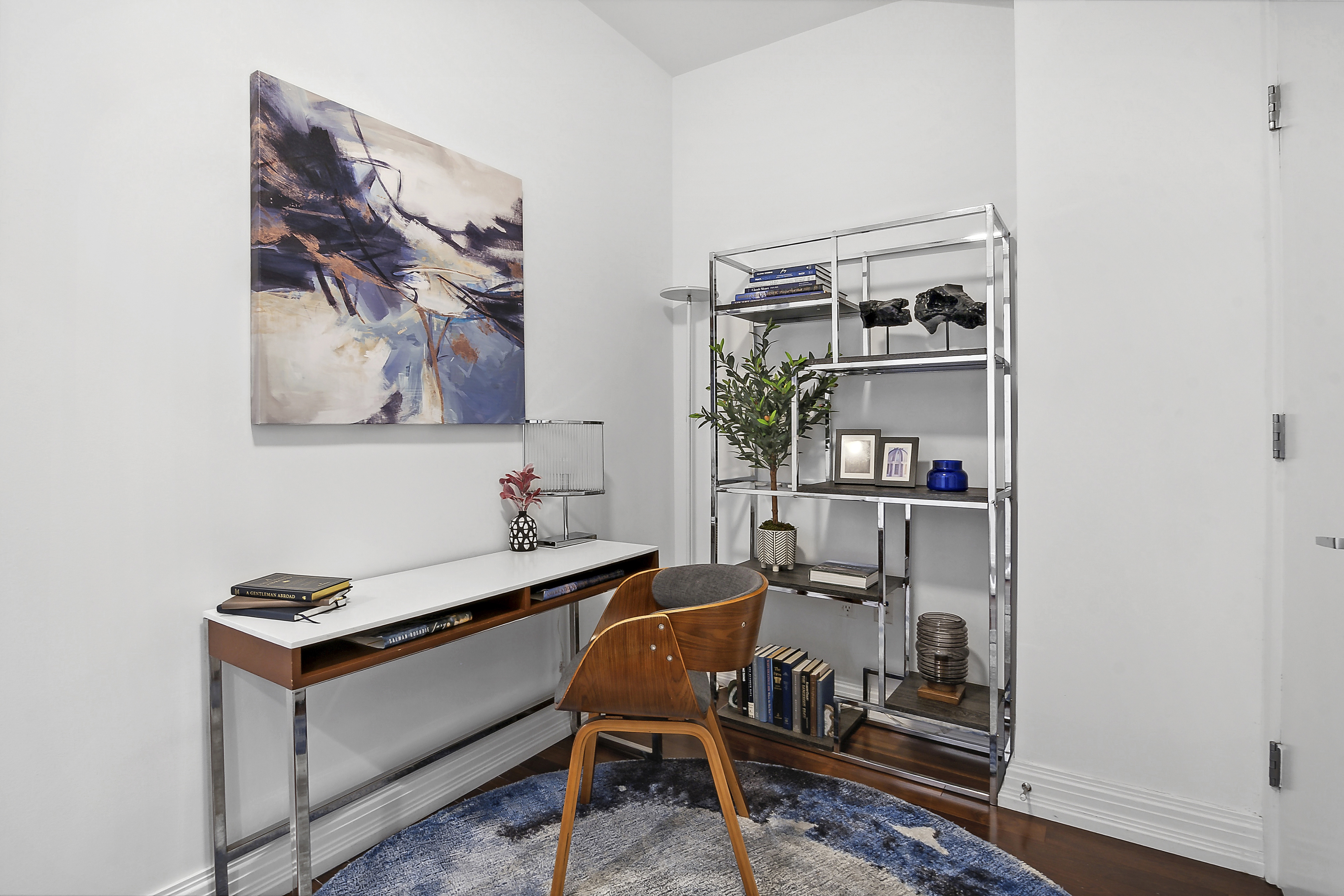 1 Hanson Place, Unit 10H Brooklyn, NY 11243 - Photo 5 of 13 a room with furniture and a book shelf