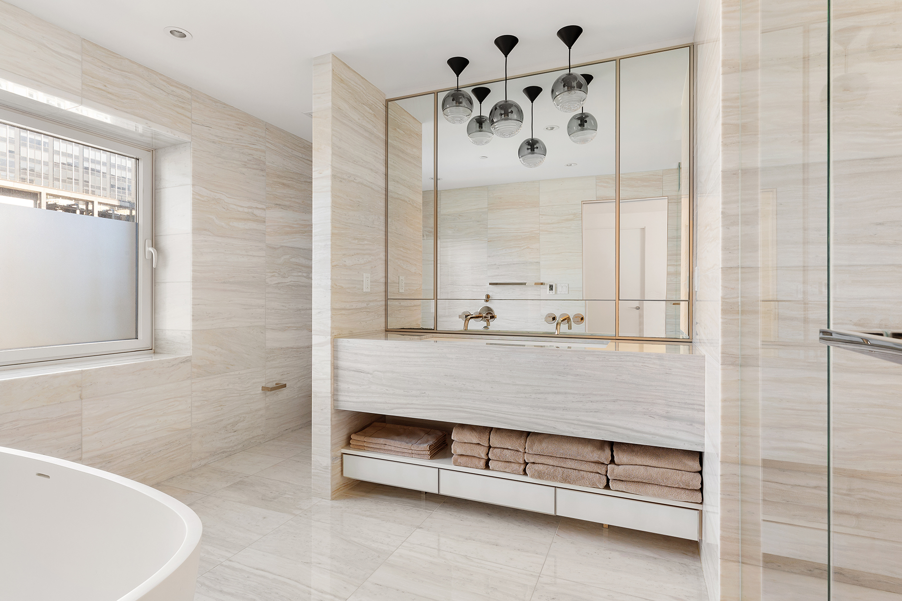 135 West 52nd Street, Unit PH3 Manhattan, NY 10019 - Photo 12 of 17 a bathroom with a bathtub and a shower