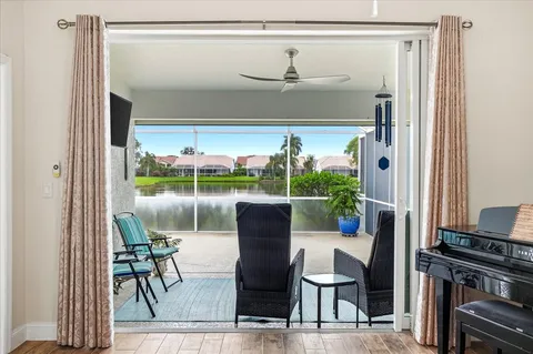 a balcony with table and chairs