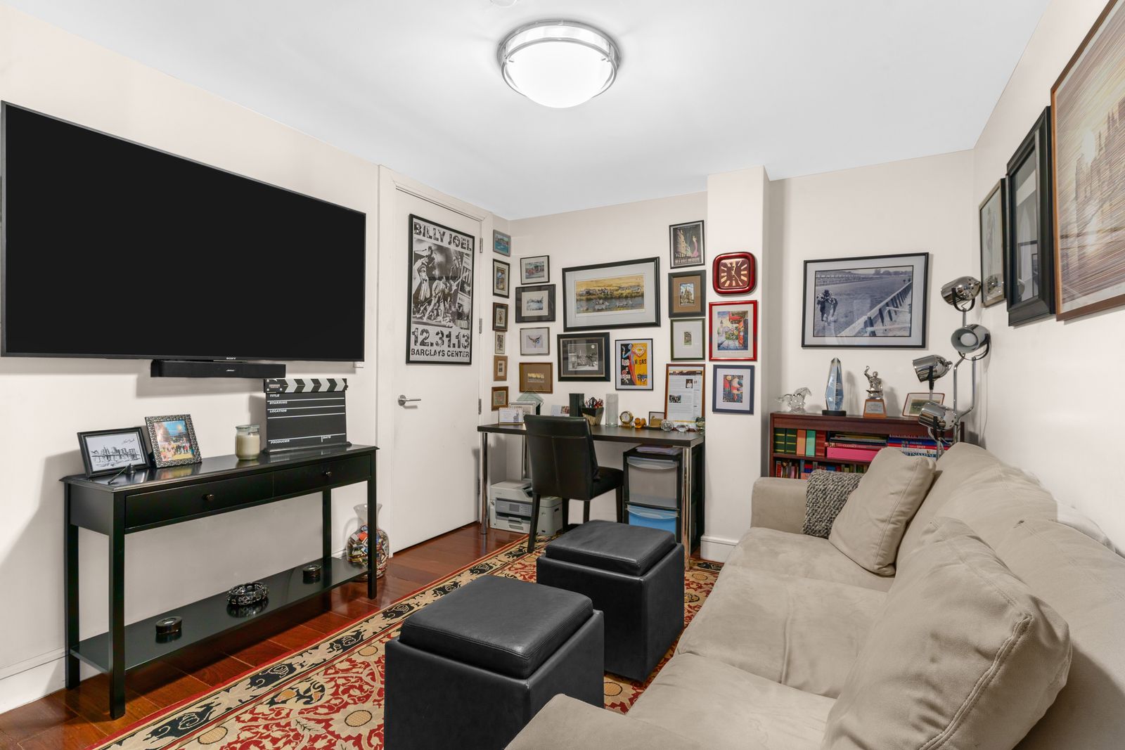 123 Baxter Street, Unit 6B Manhattan, NY 10013 - Photo 9 of 18 a living room with furniture and a flat screen tv