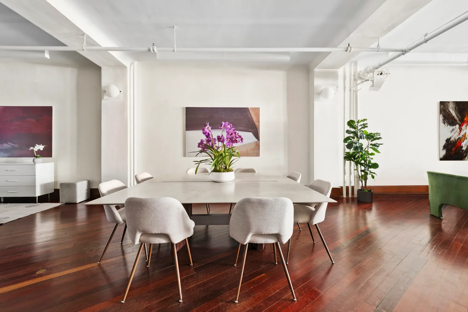 a view of a dining room with furniture window and wooden floor