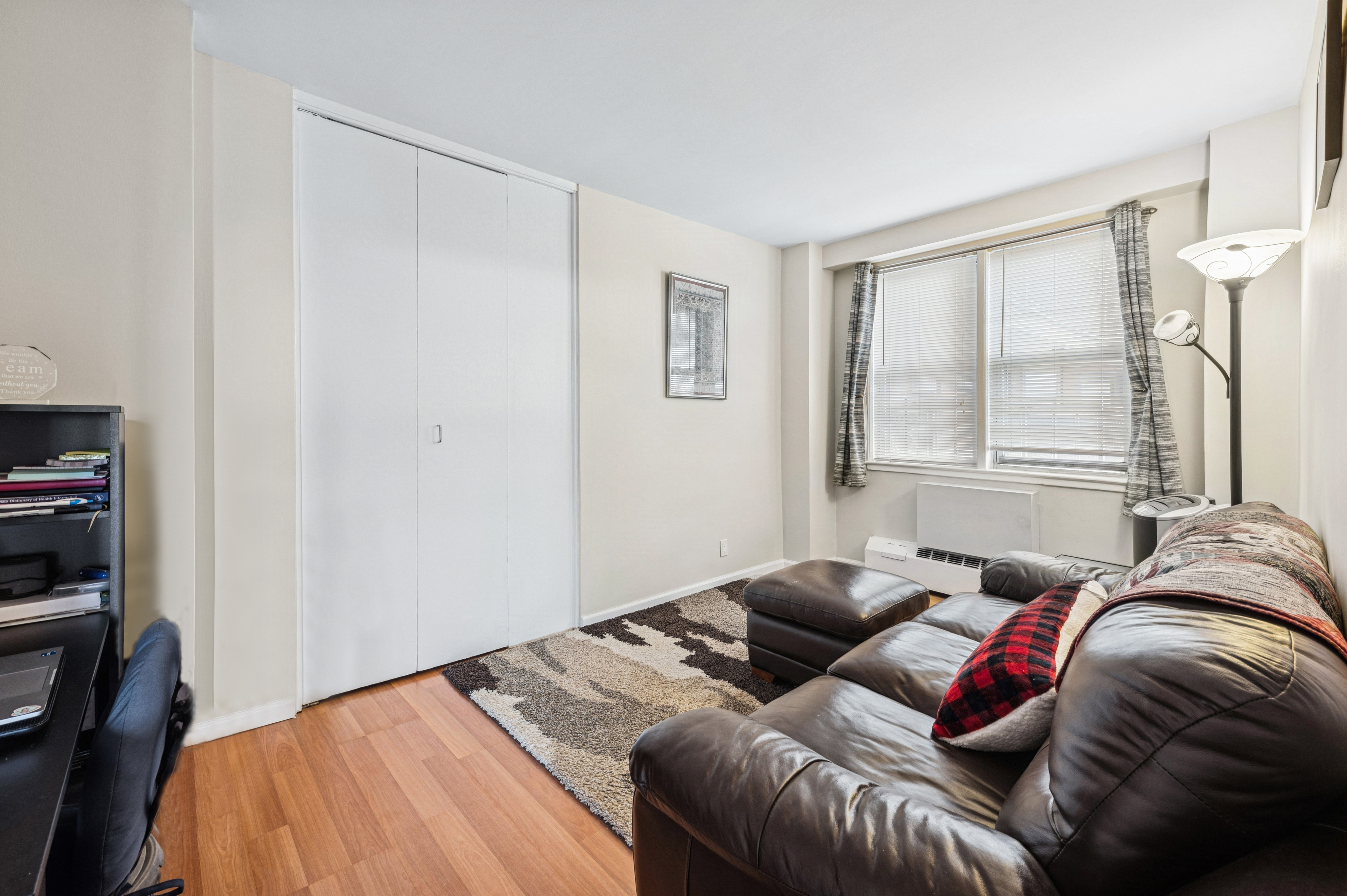 5700 Arlington Avenue, Unit 7G Bronx, NY 10471 - Photo 5 of 16 a bed sitting in a bedroom next to a window