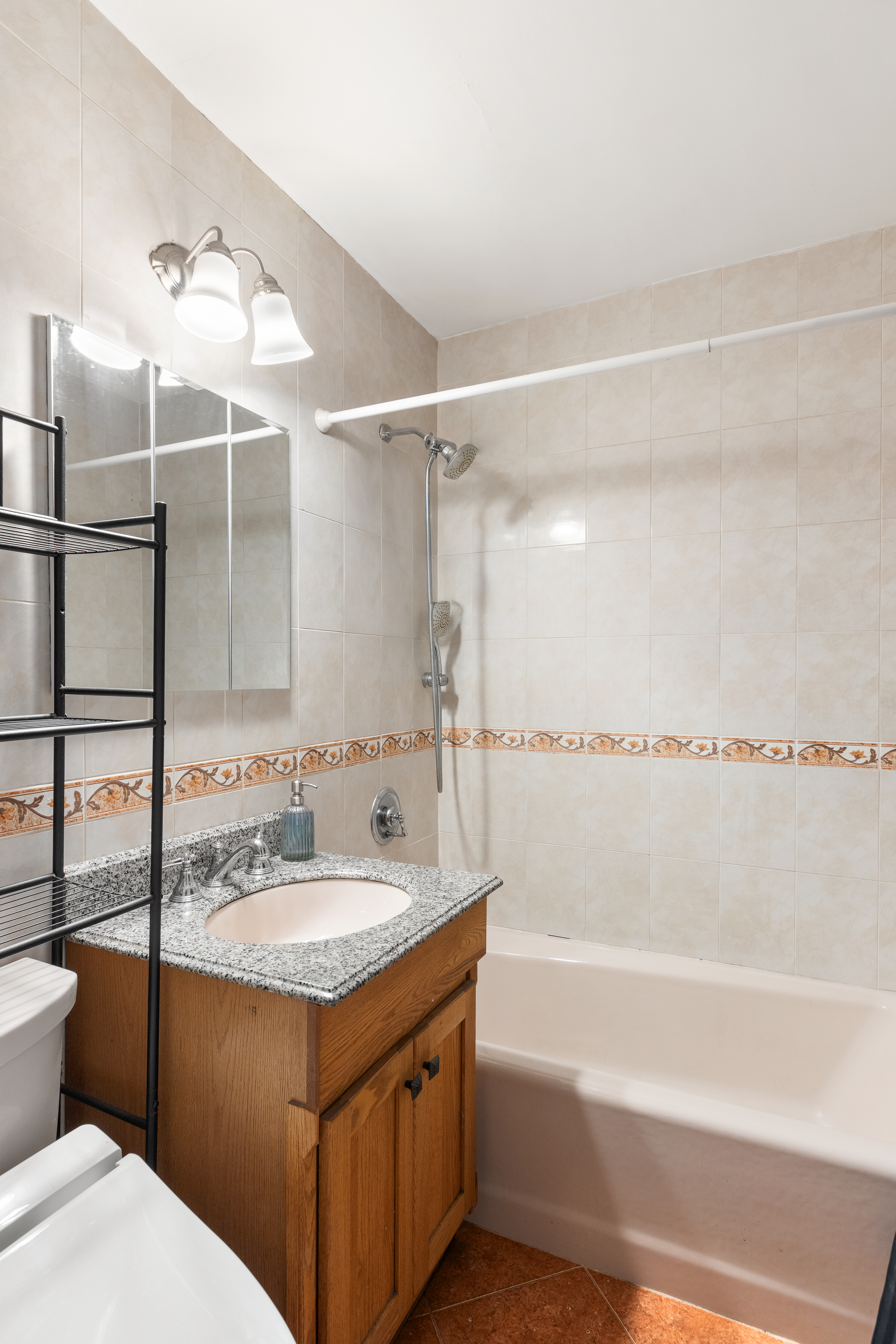 495 East 7th Street, Unit 2F Brooklyn, NY 11218 - Photo 7 of 10 a bathroom with a bathtub and a sink