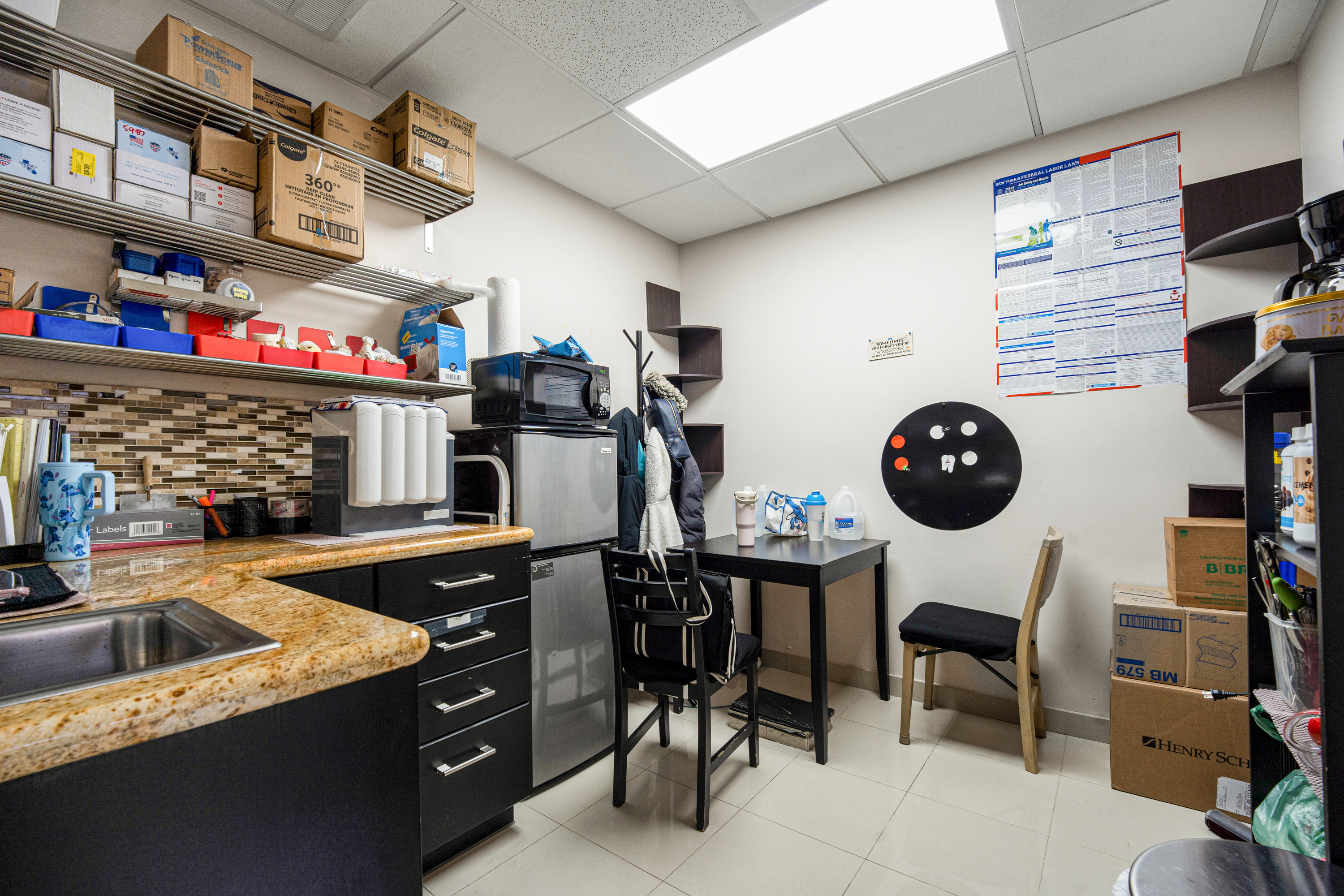 62-22 Myrtle Avenue Queens, NY 11385 - Photo 9 of 13 a kitchen with a table and chairs