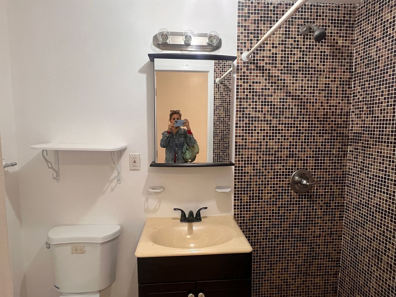 1218 Nostrand Avenue, Unit 1 Brooklyn, NY 11225 - Photo 5 of 5 a bathroom with a sink toilet and mirror