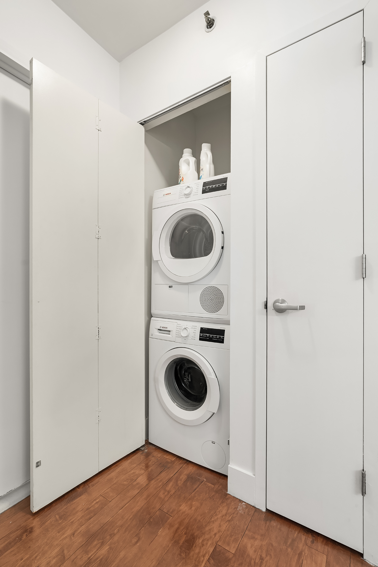242 East 25th Street, Unit 3A Manhattan, NY 10010 - Photo 6 of 9 a view of a small space with washer and dryer