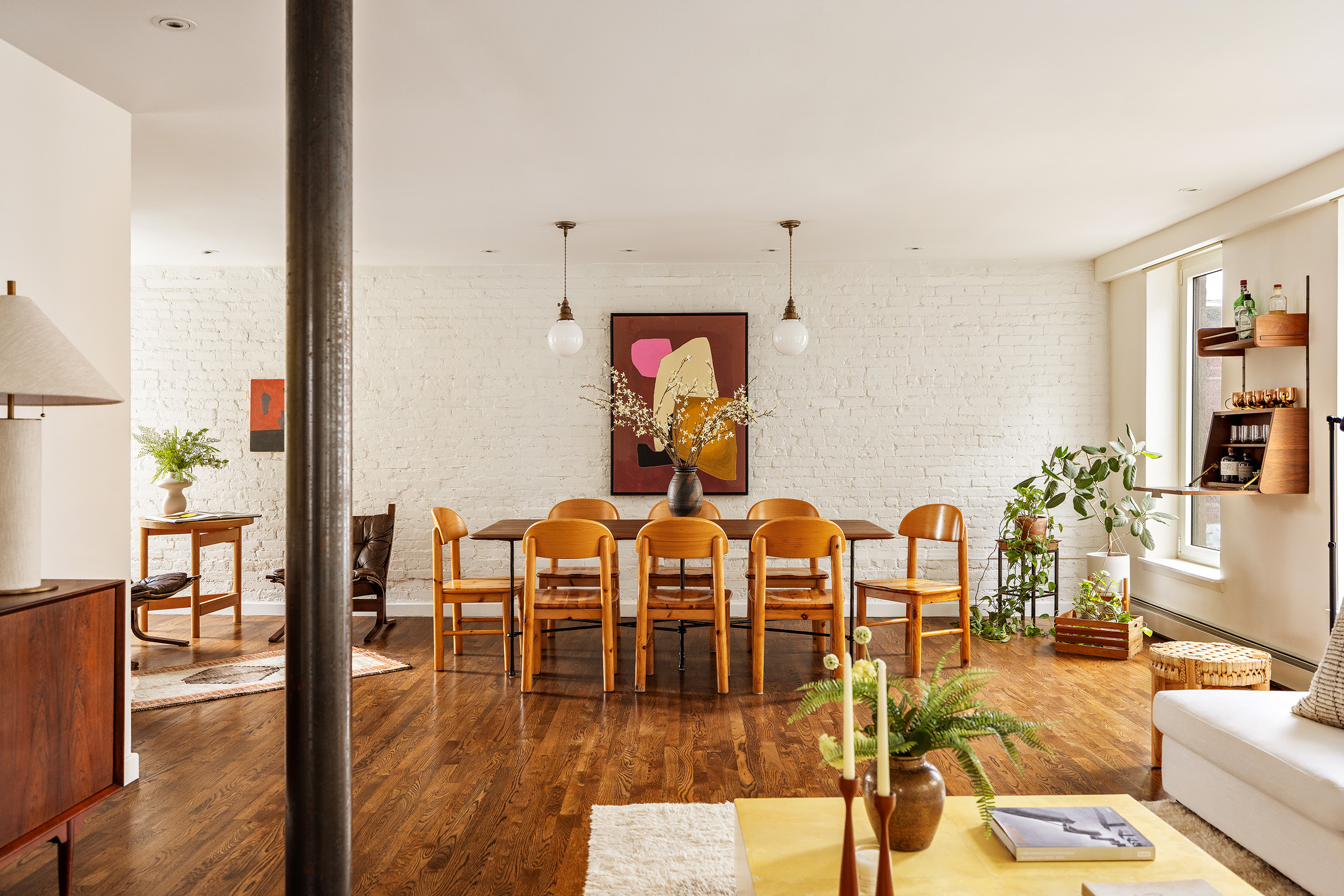211 East 3rd Street, Unit 5R Manhattan, NY 10009 - Photo 4 of 16 a living room with fireplace furniture and wooden floor